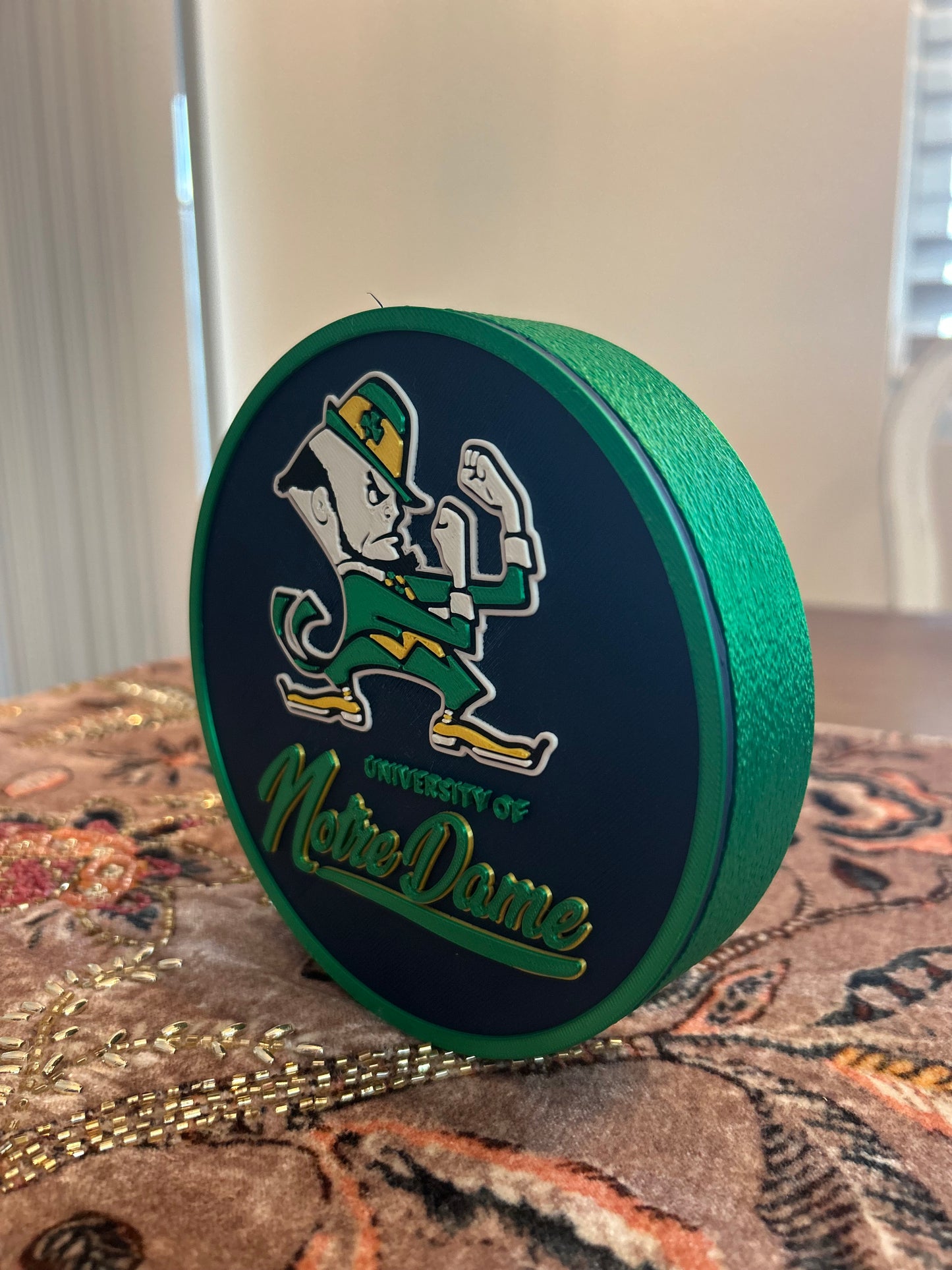 Notre Dame Fighting Irish leprechaun 3D printed round storage box with blue base and wedge display stand