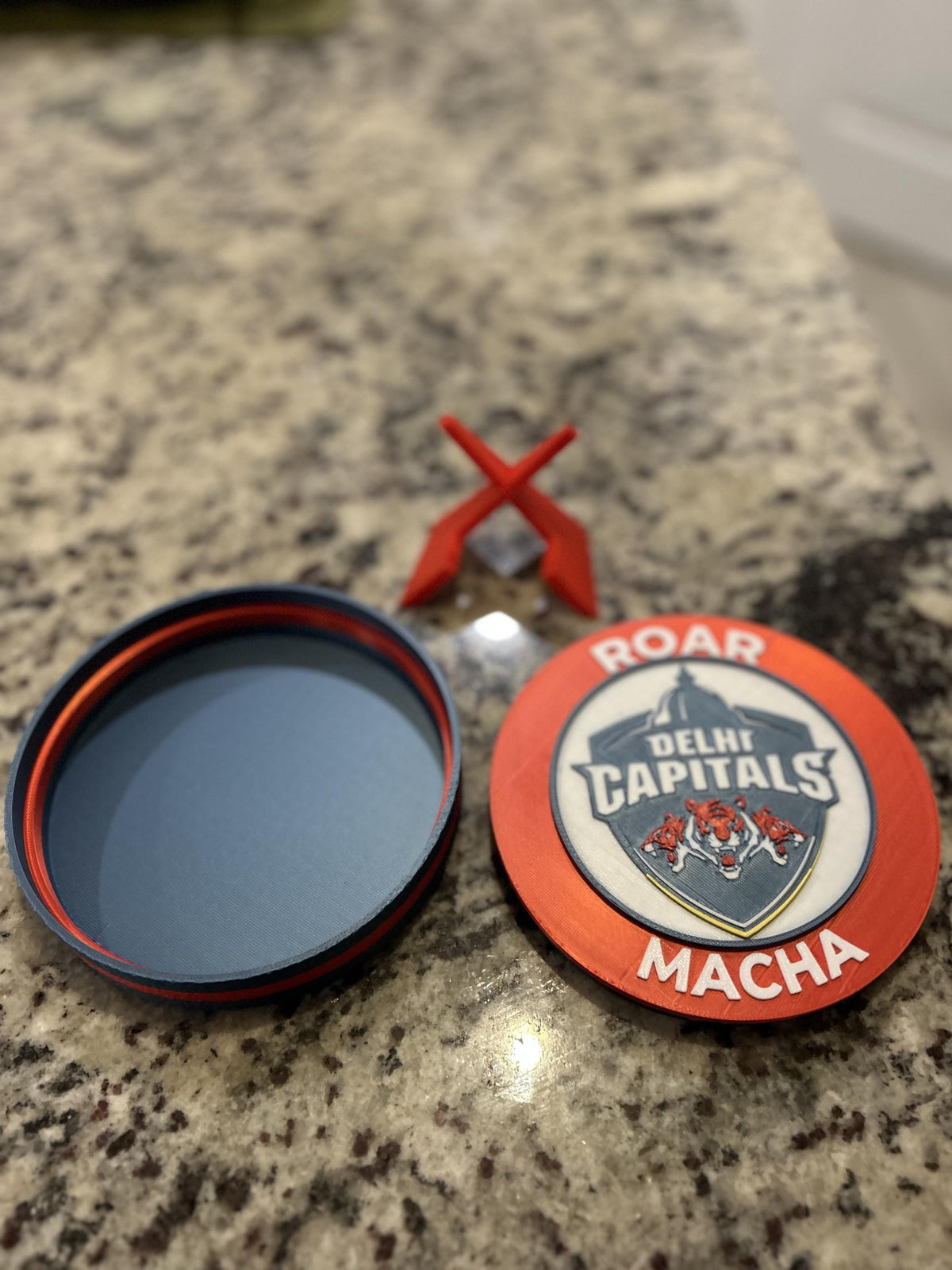 Delhi Capitals 3D printed red roundel display with stand and hidden stash box, personalized Roar Macha IPL cricket fan gift, made in USA