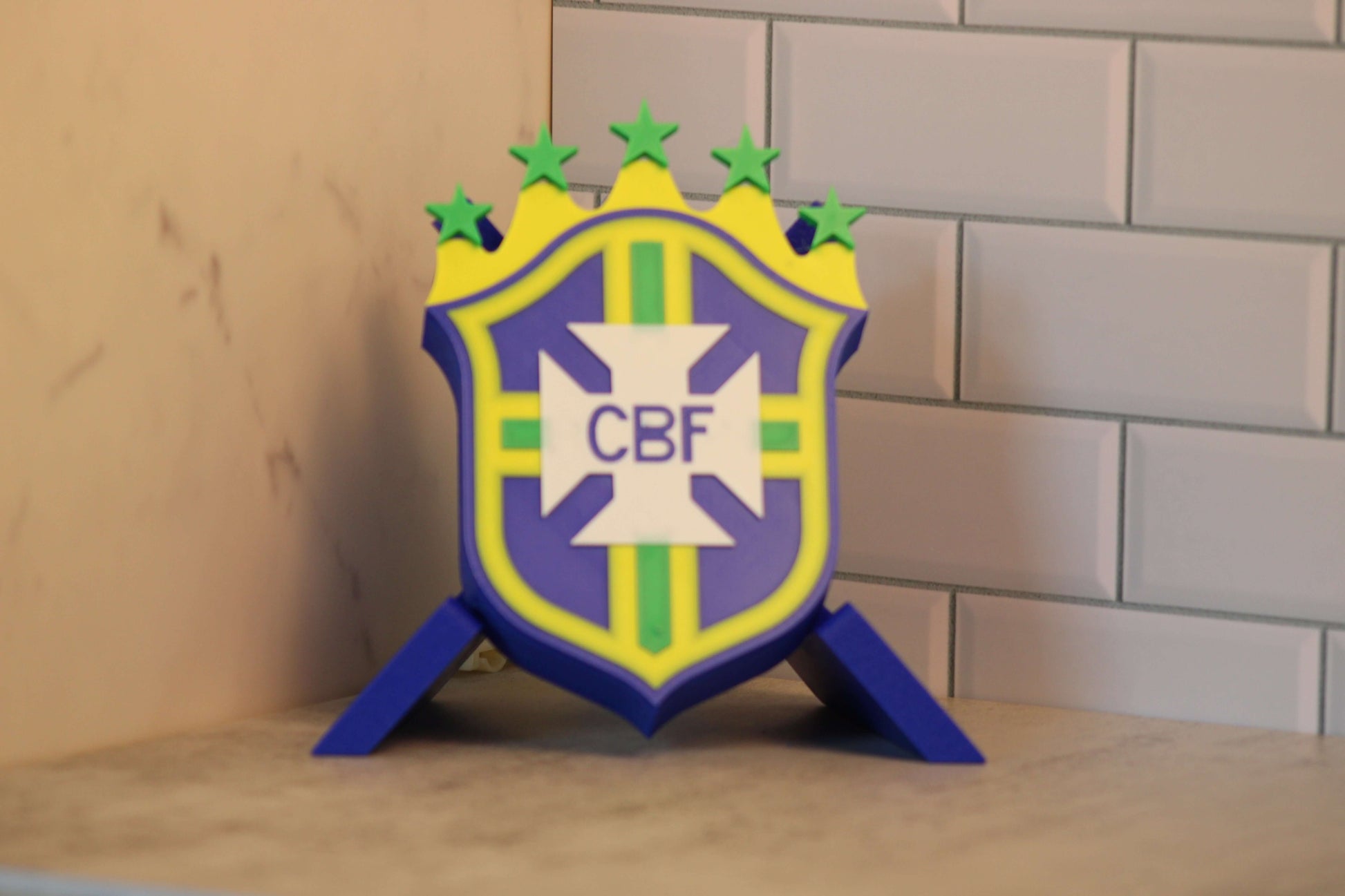 Brazil National Team 3D printed emblem in vibrant colors, celebrating 5 World Cup wins, perfect for soccer fans.