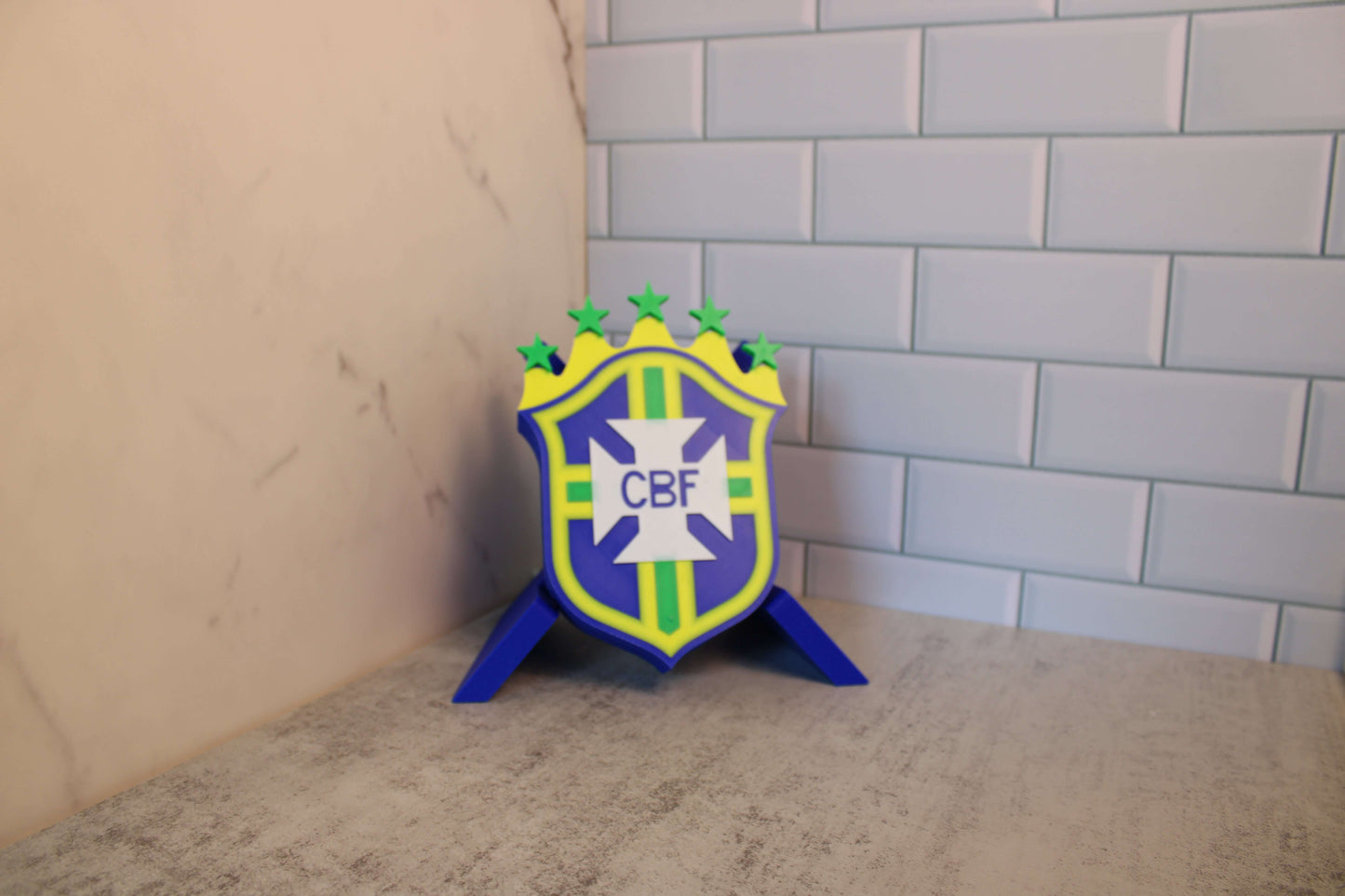 Brazil National Team 3D Printed Emblem on display, vibrant colors and high-quality materials, tribute to 5 World Cup wins.