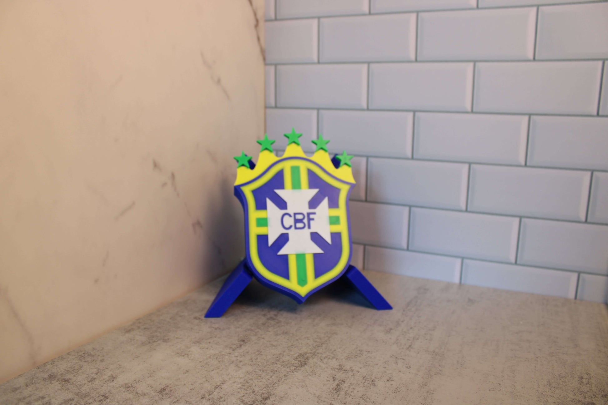Brazil National Team 3D Printed Emblem on display, vibrant colors and high-quality materials, tribute to 5 World Cup wins.