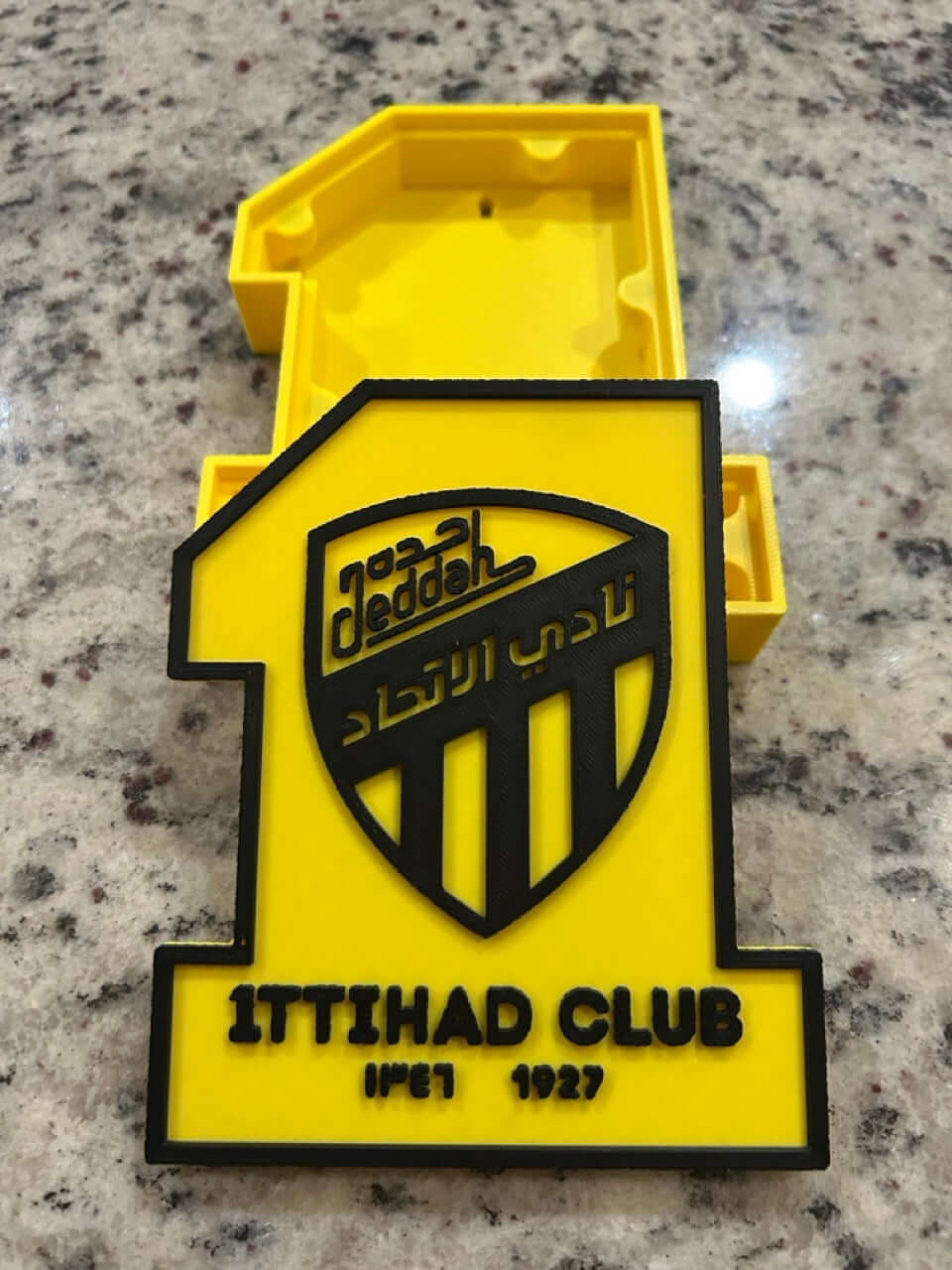 3D printed Al-Ittihad Club plaque in yellow with logo, high-quality fan decor for soccer enthusiasts.