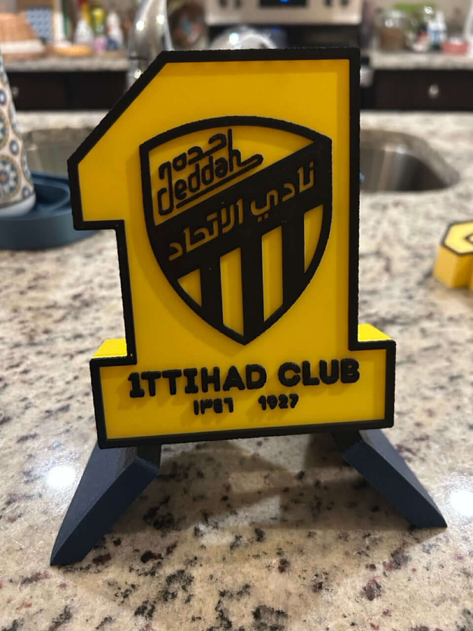 Al-Ittihad Club 3D printed plaque displaying iconic logo in vibrant colors, perfect fan decor for soccer enthusiasts.