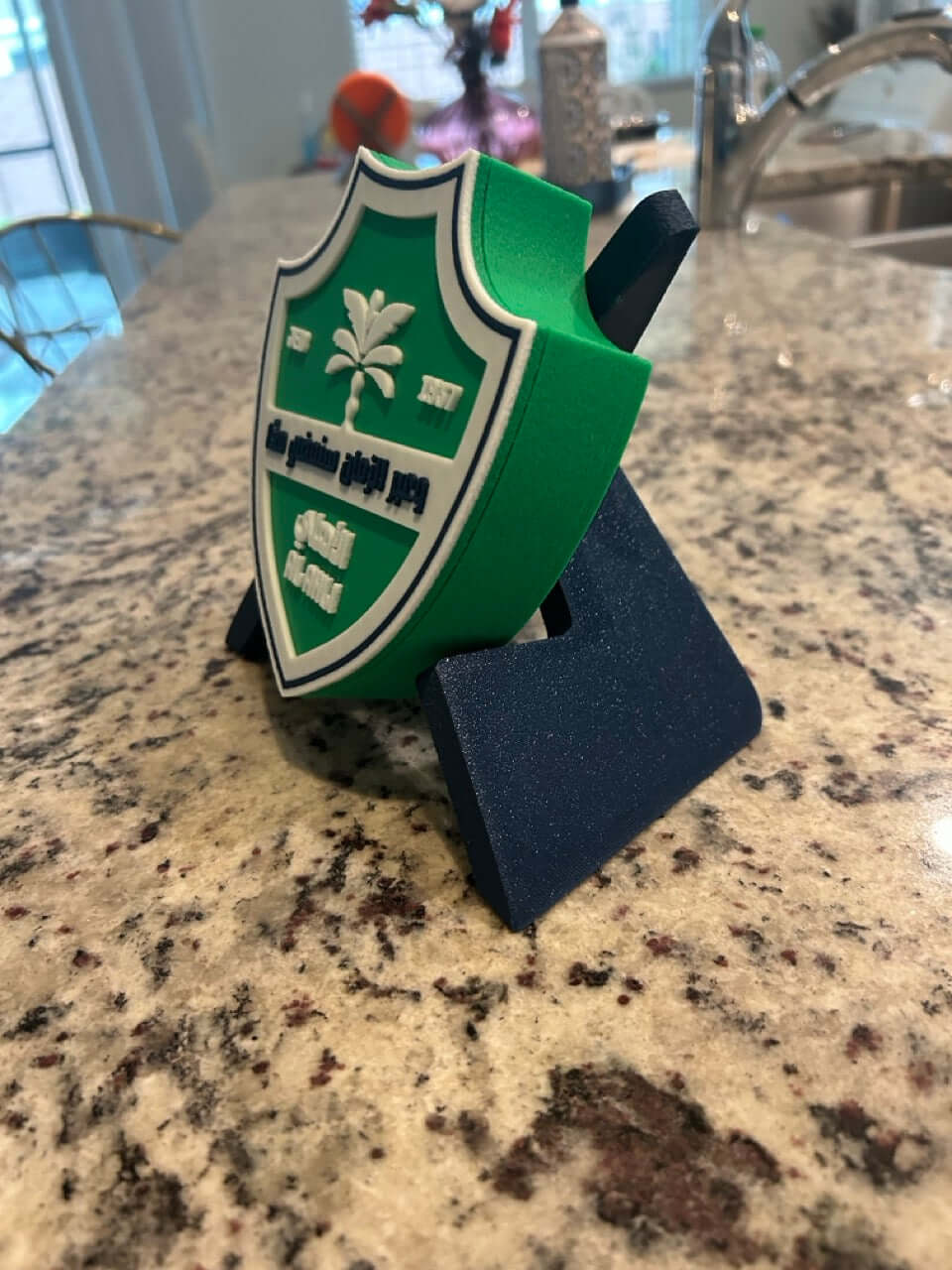 Customizable 3D printed Al-Ahli FC plaque in vibrant green and blue, showcasing the iconic emblem on a stylish stand.