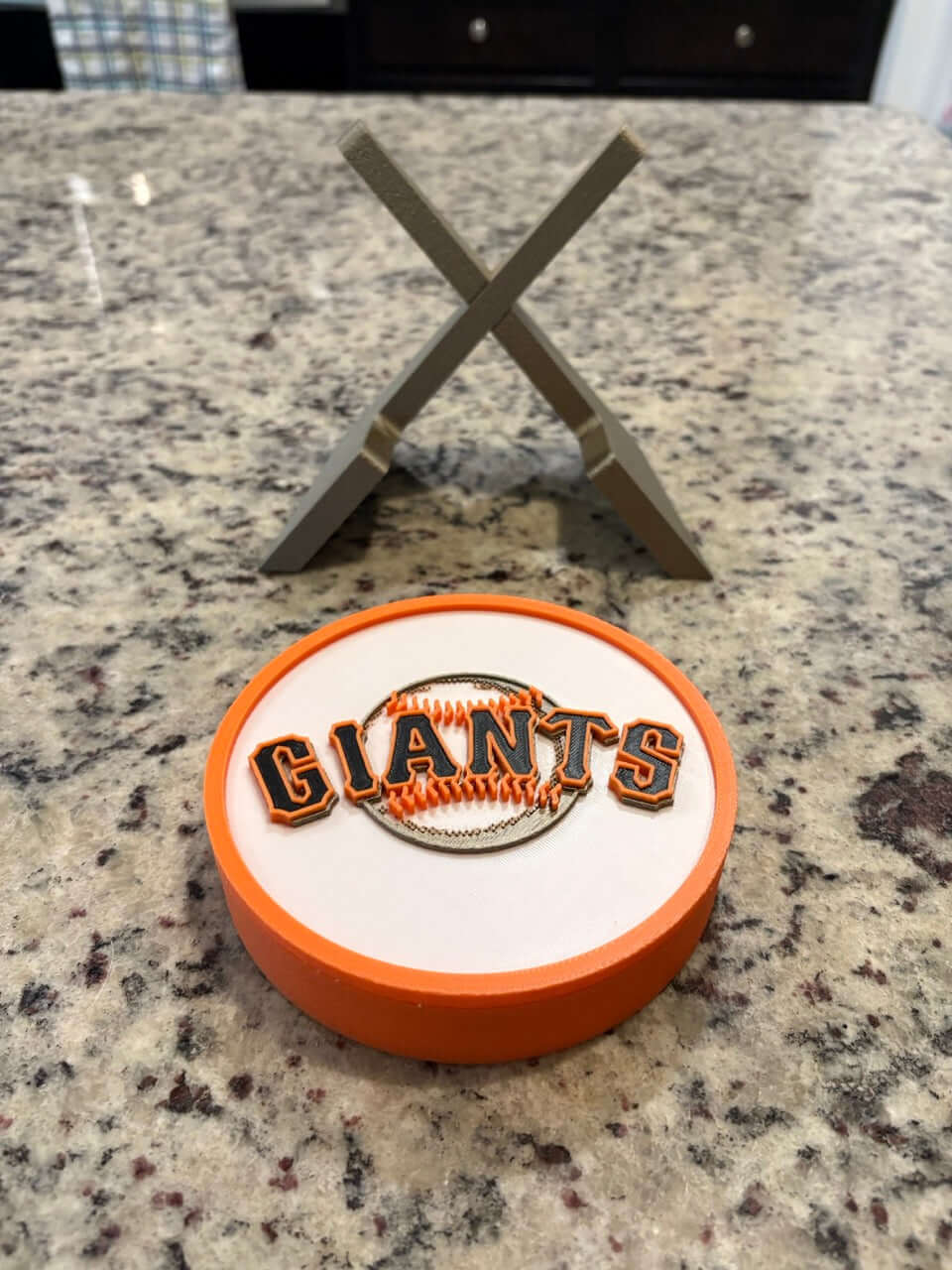 3D printed San Francisco Giants plaque on granite countertop, showcasing vibrant colors and high-quality materials for sports decor.