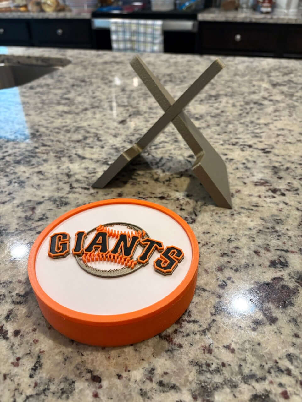 Customized San Francisco Giants 3D printed plaque on granite countertop, showcasing vibrant colors and unique design.