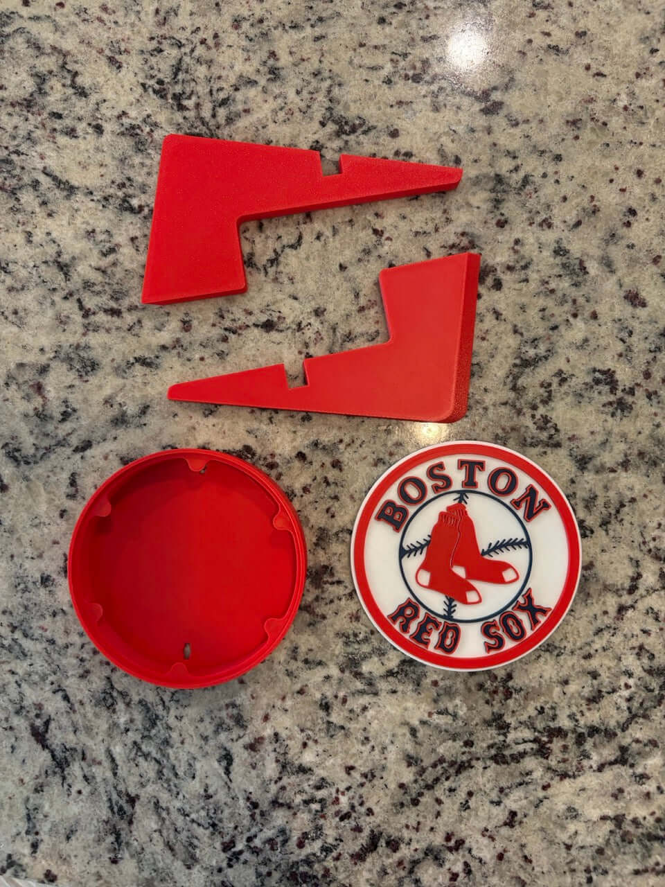 Customized Boston Red Sox 3D printed plaque pieces in vibrant red, showcasing unique MLB fan decor for sports enthusiasts.