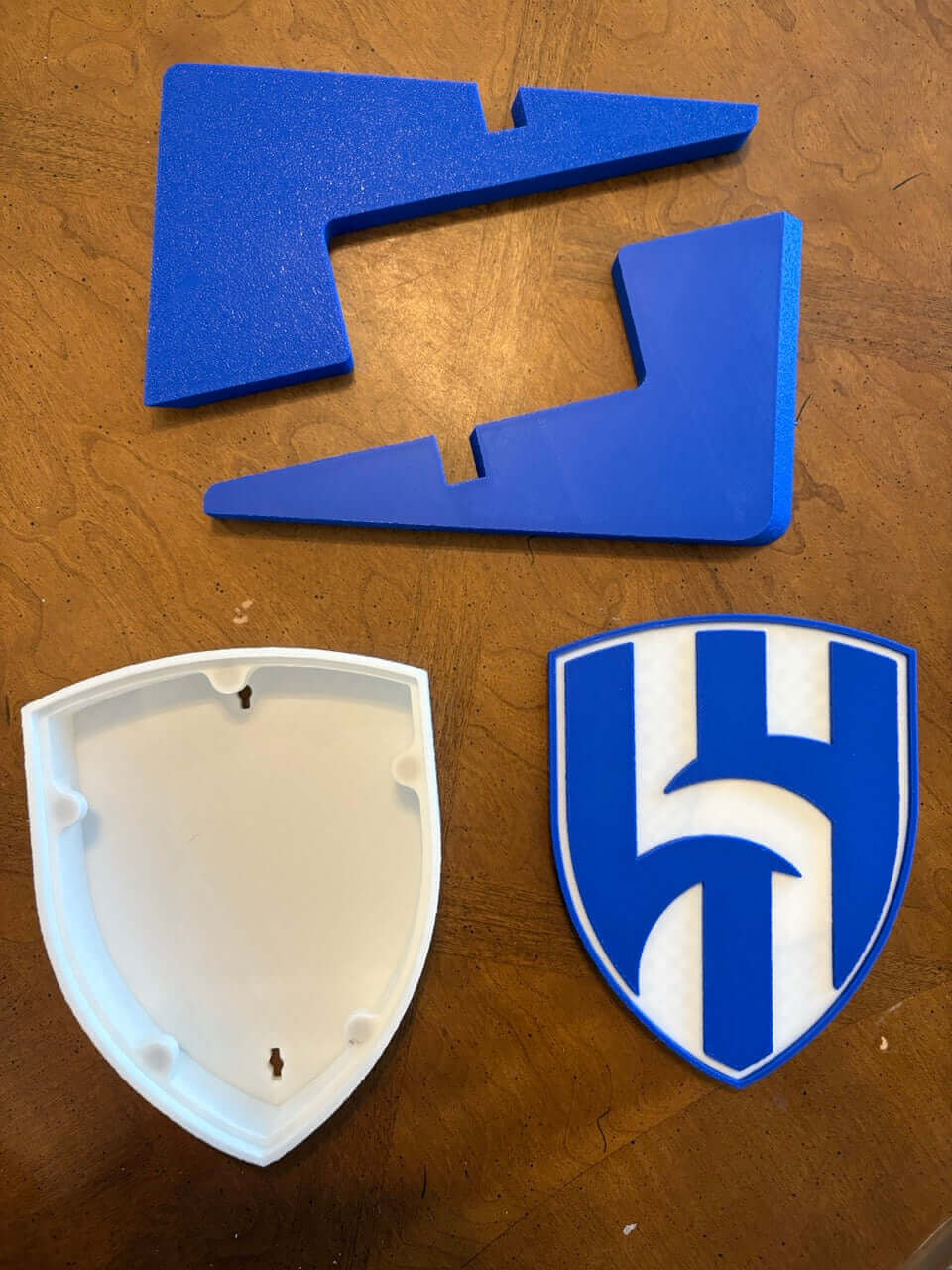 Al Hilal FC 3D printed plaque components: blue pieces and iconic crest base for soccer decor.