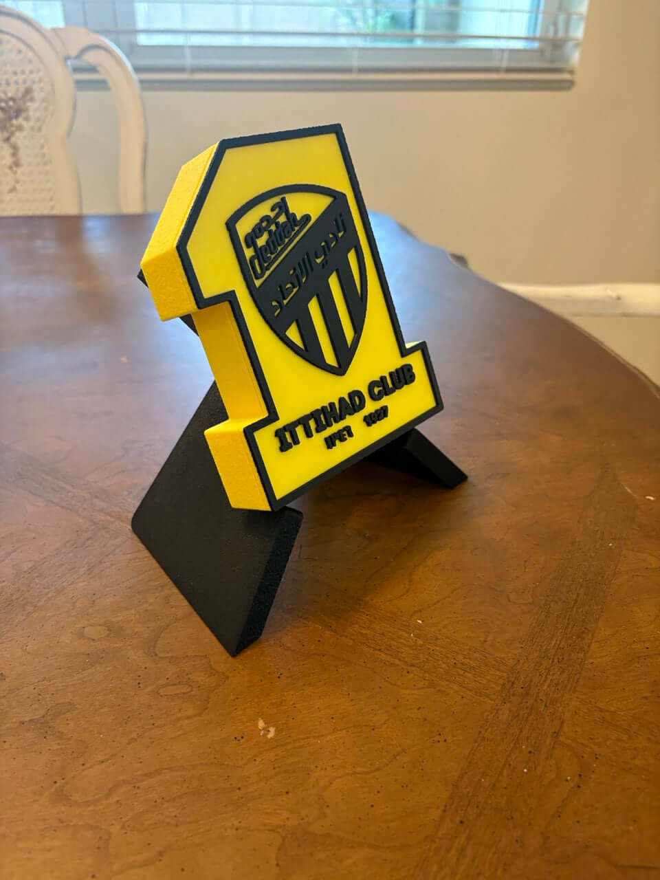 Al-Ittihad Club 3D printed plaque in vibrant yellow and black color, perfect for football fan decor.