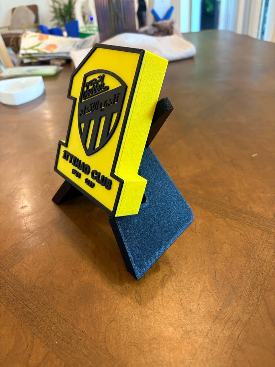 3D printed Al-Ittihad Club plaque in vibrant yellow and black, showcasing team spirit and unique decor.