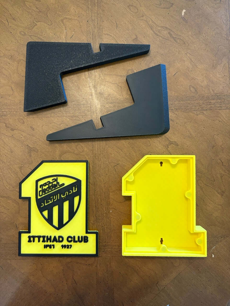 Unique Al-Ittihad Club 3D printed plaque pieces in vibrant colors for passionate football fans.