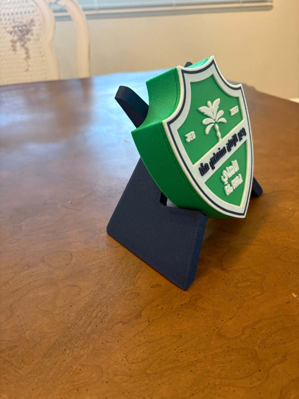Al-Ahli Saudi FC 3D printed plaque displayed on a wooden table, featuring vibrant green and white colors.