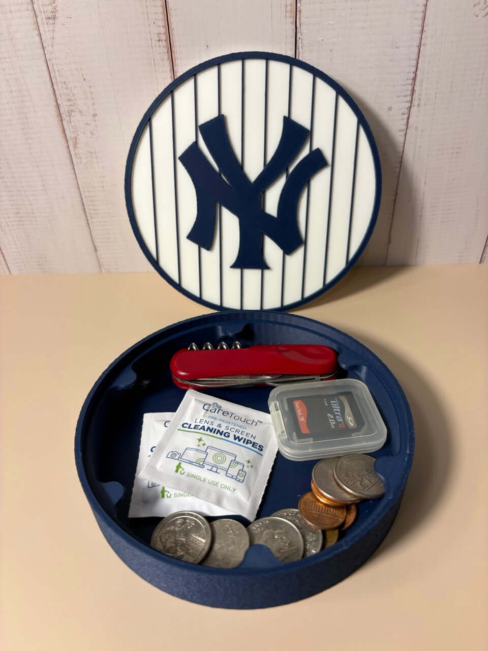 NY Yankees 3D Logo Stash Box displaying coins and items; vibrant colors, unique design for MLB fans, no assembly required.