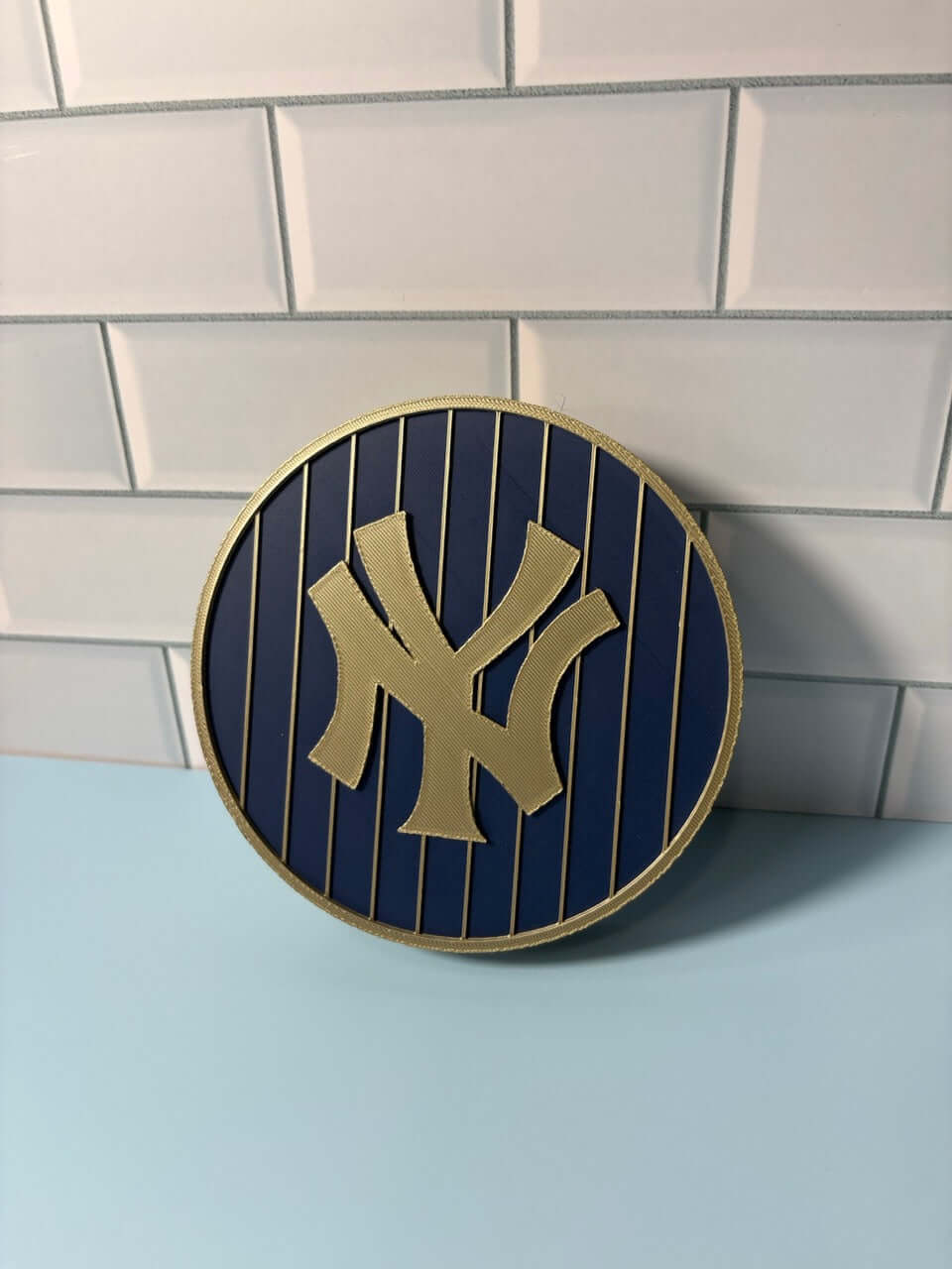 NY Yankees 3D Logo Stash Box in blue and iridium gold, showcasing vibrant colors and unique design.