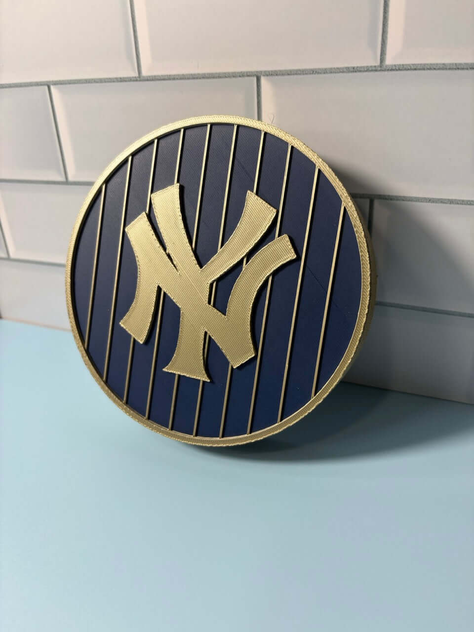 NY Yankees 3D Logo Stash Box in blue and iridium gold, showcasing vibrant colors and high-quality materials.