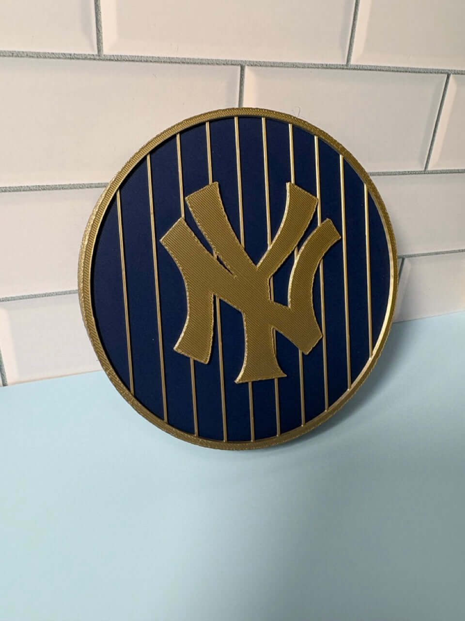 NY Yankees 3D Logo Stash Box featuring vibrant blue and iridium gold colors, unique piece made from high-quality materials.