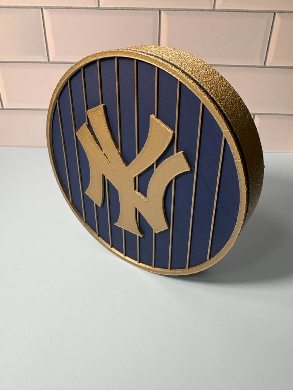NY Yankees 3D logo stash box in blue and iridium gold, showcasing vibrant colors and high-quality materials.