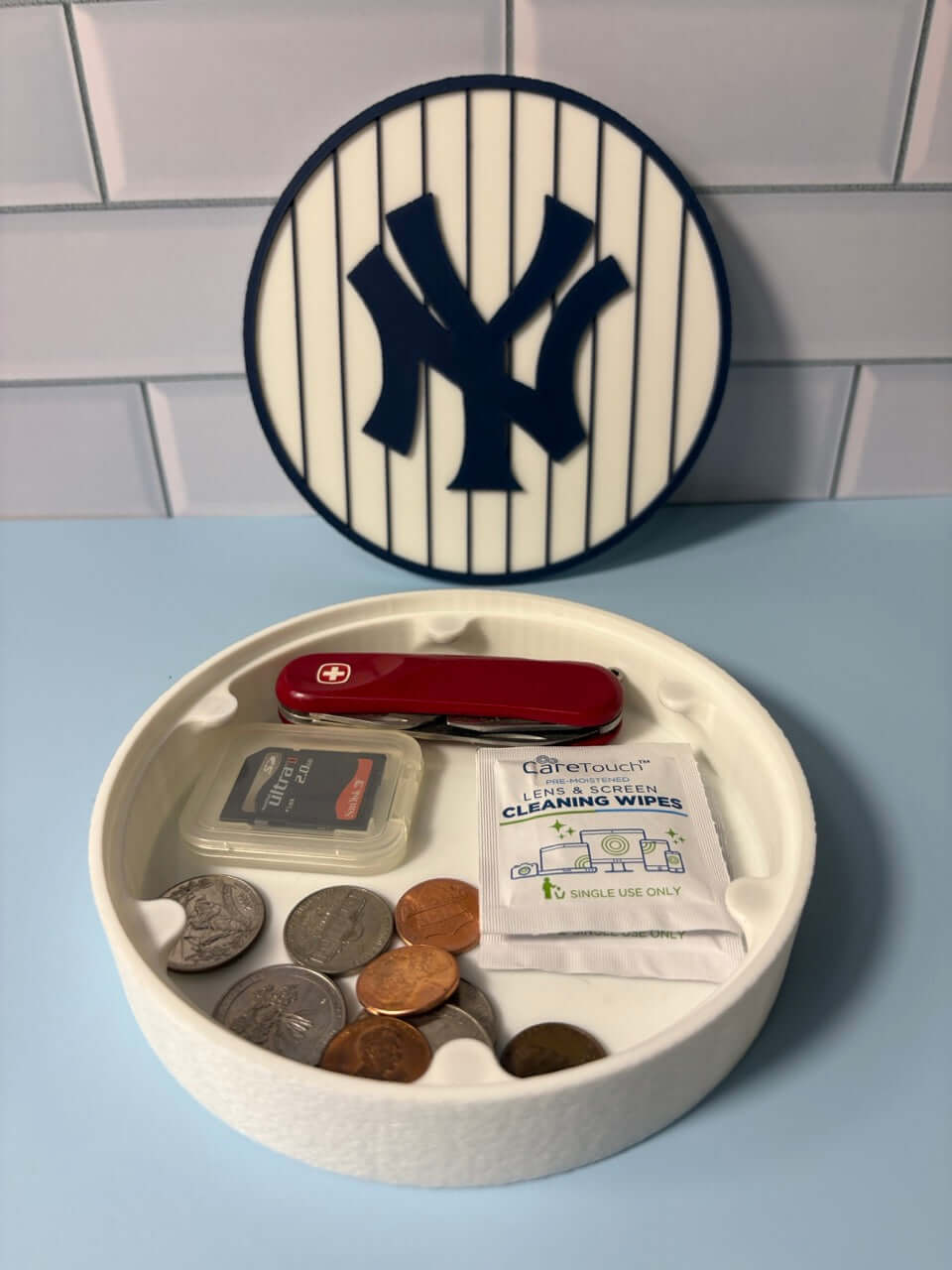 NY Yankees 3D logo stash box with coins and tools, showcasing vibrant colors and custom prints for baseball fans.