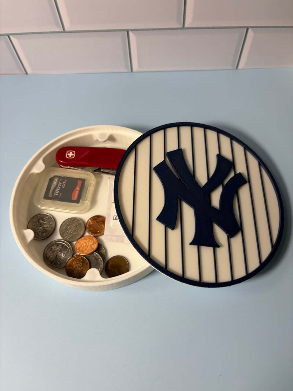 NY Yankees 3D Logo Stash Box showcasing vibrant colors, perfect for baseball fans to store coins and small items.