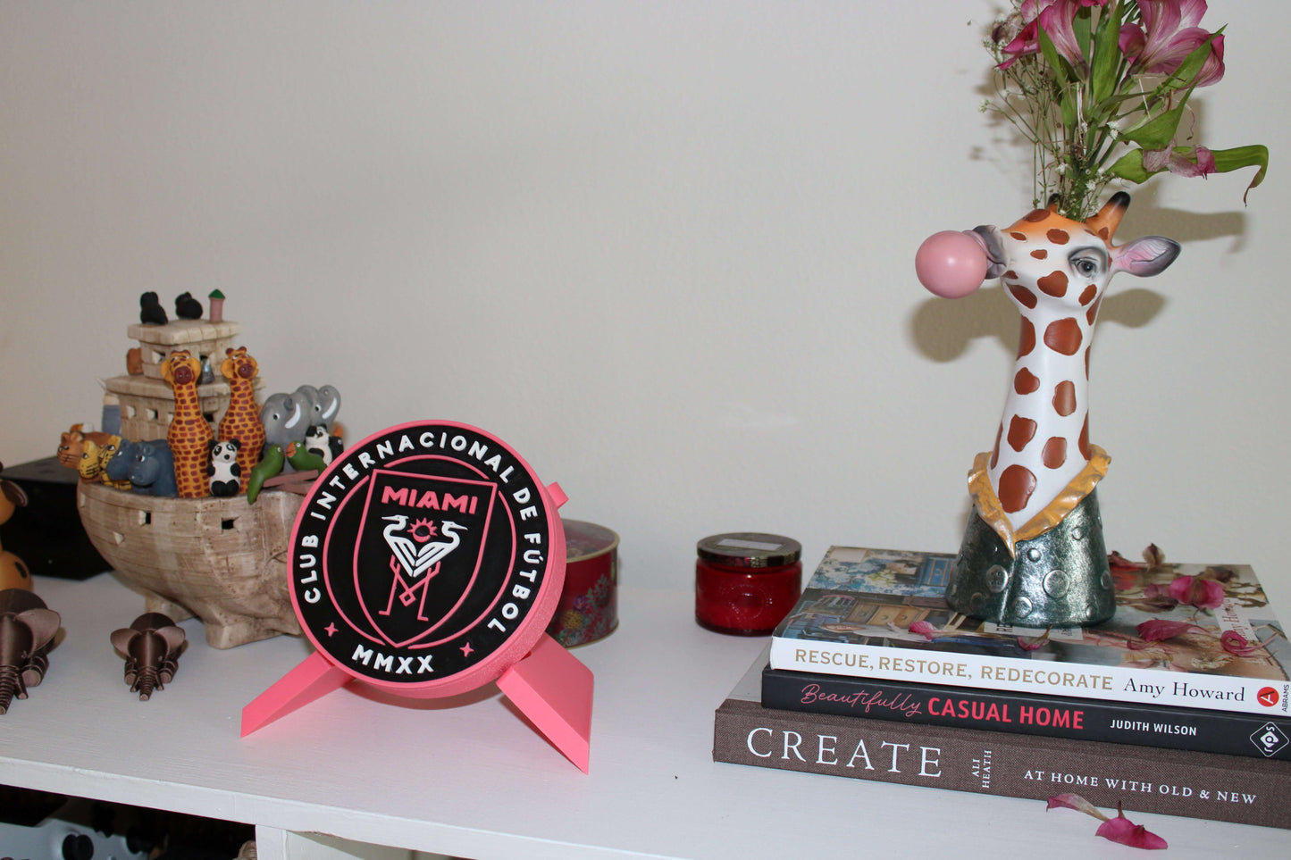 Stylish 3D printed Inter Miami emblem decor on shelf, perfect for soccer lovers and Messi fans.