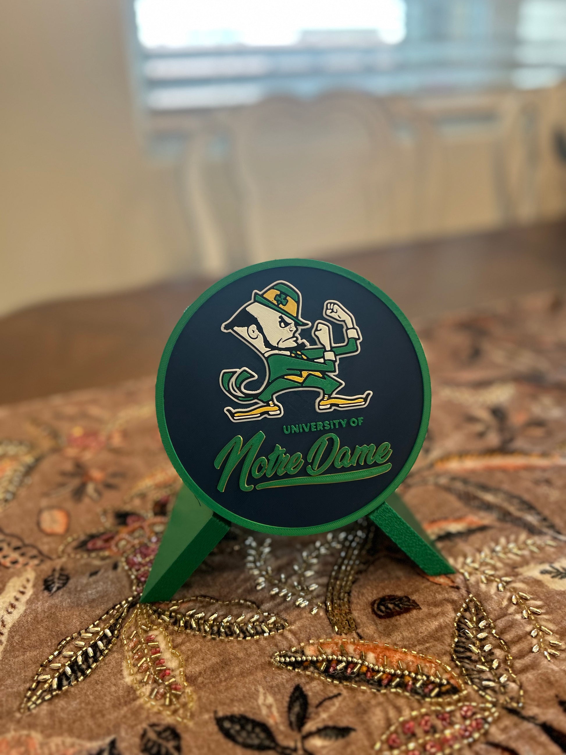 Notre Dame Fighting Irish leprechaun 3D printed round storage box with blue base and wedge display stand