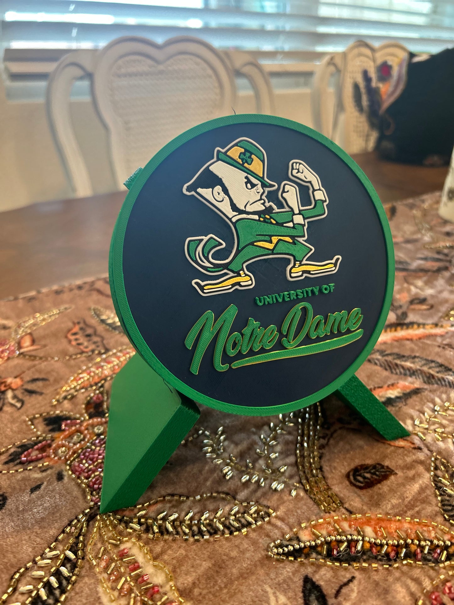 Notre Dame Fighting Irish leprechaun 3D printed round storage box with blue base and wedge display stand