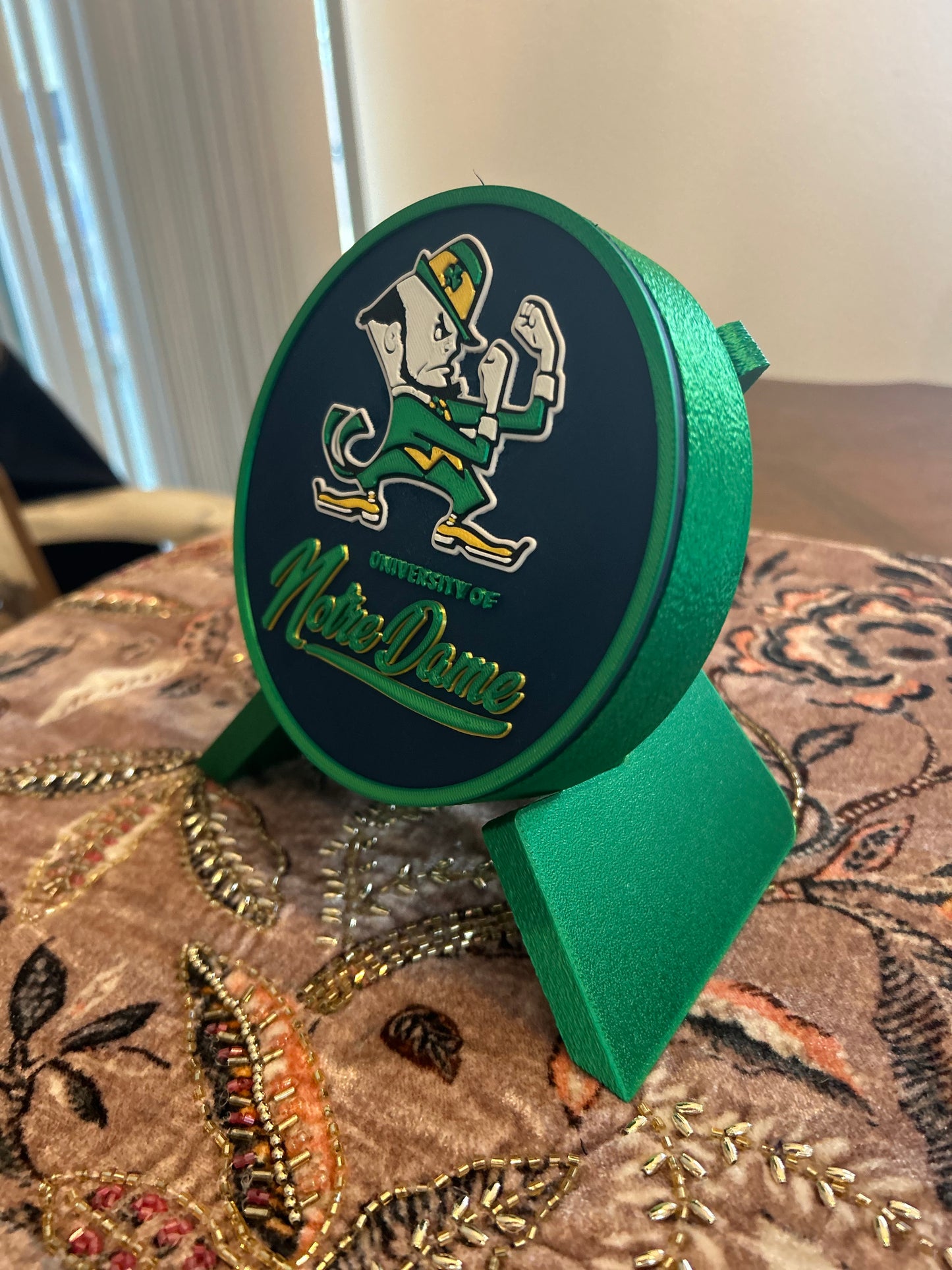 Notre Dame Fighting Irish leprechaun 3D printed round storage box with blue base and wedge display stand