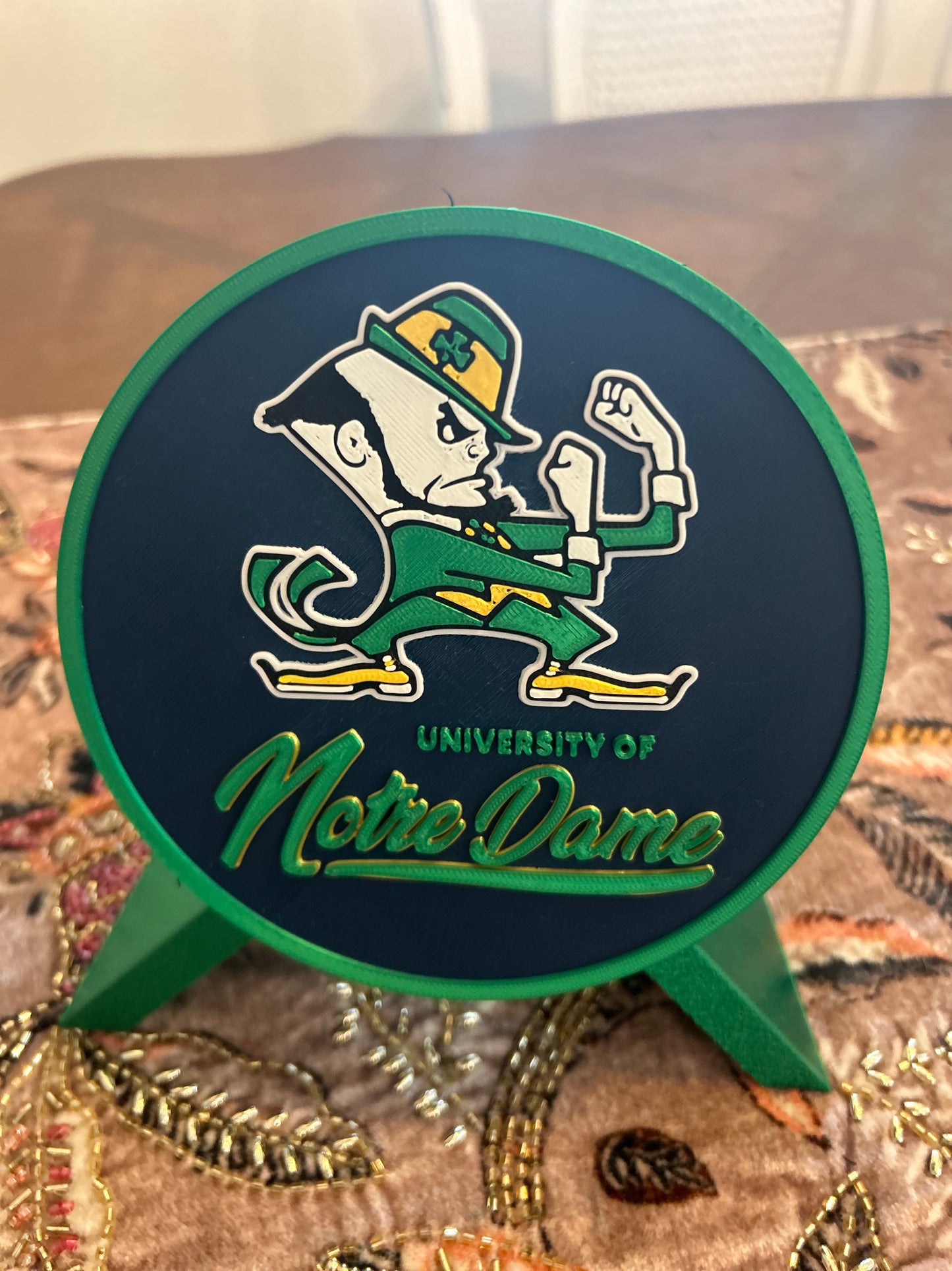 Notre Dame Fighting Irish leprechaun 3D printed round storage box with blue base and wedge display stand