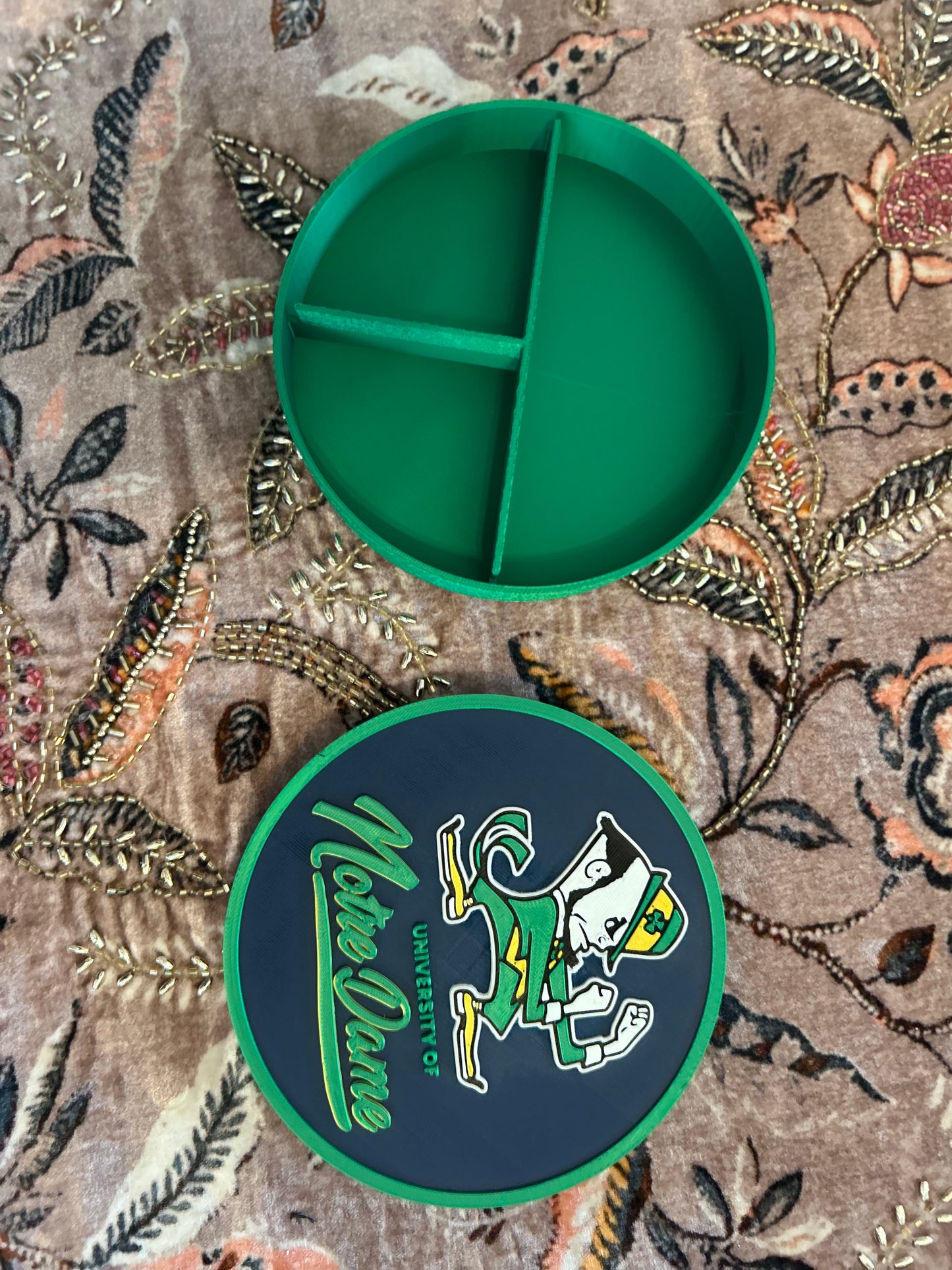Notre Dame Fighting Irish leprechaun 3D printed round storage box with blue base and wedge display stand
