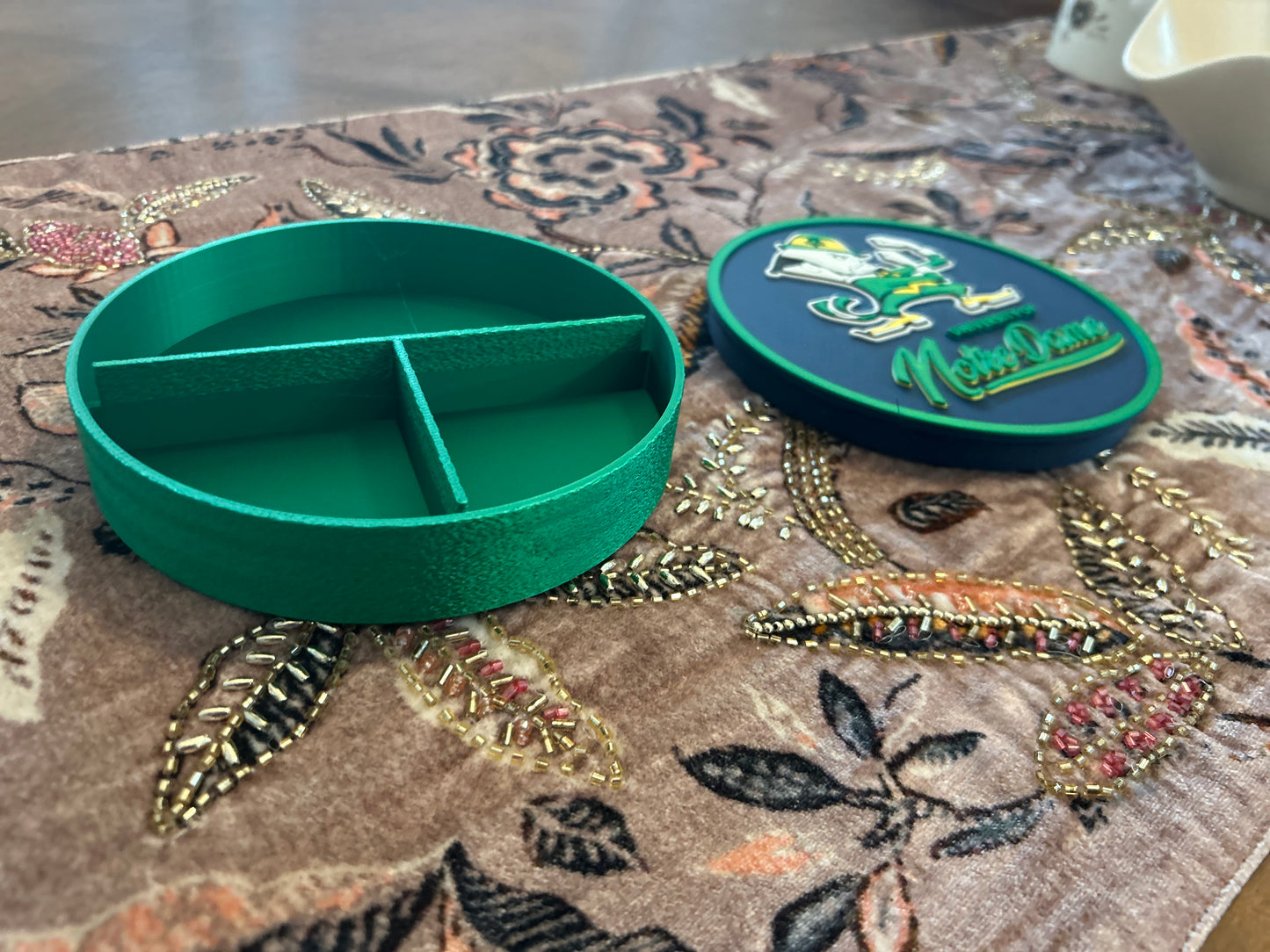 Notre Dame Fighting Irish leprechaun 3D printed round storage box with blue base and wedge display stand