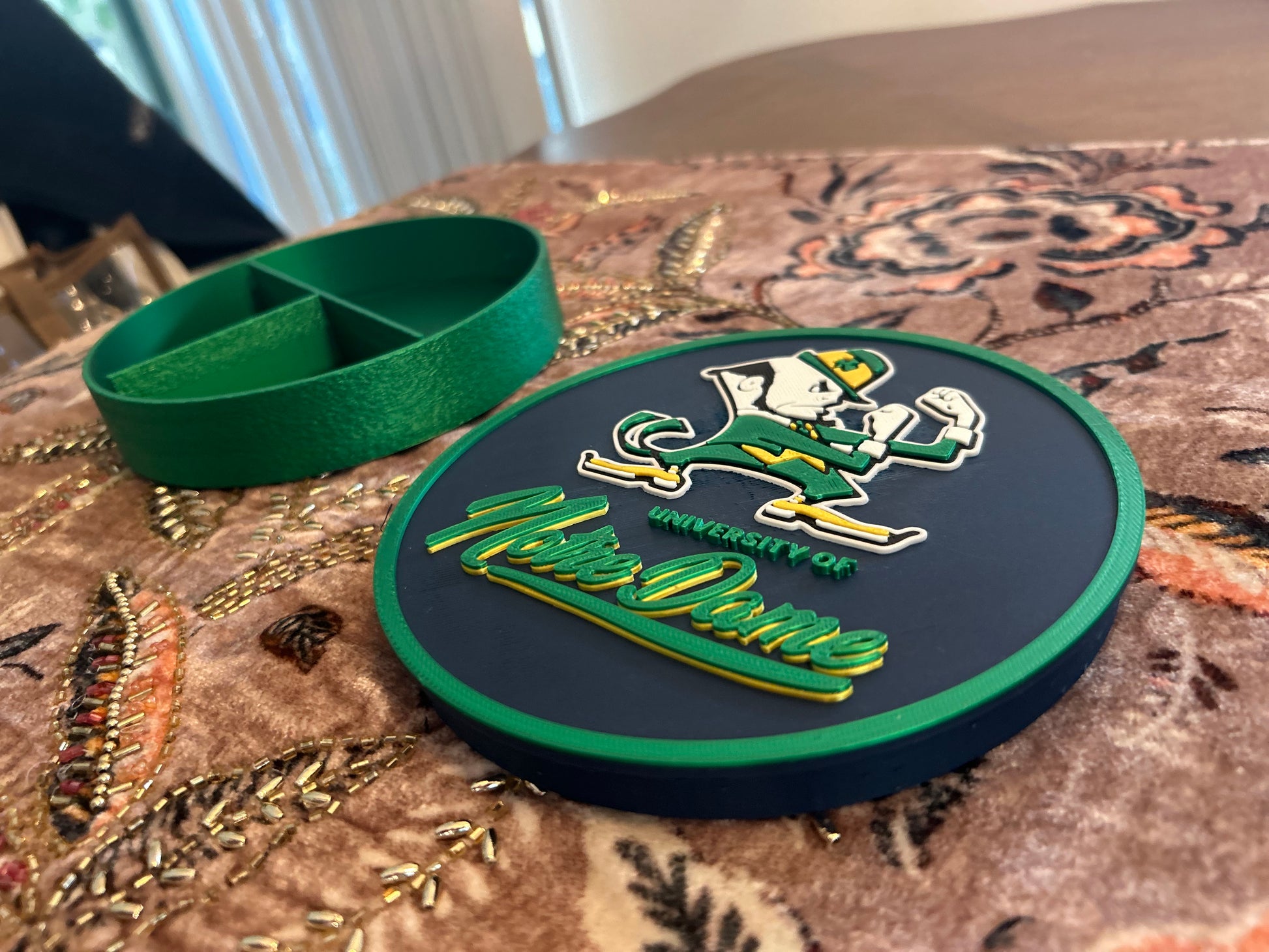 Notre Dame Fighting Irish leprechaun 3D printed round storage box with blue base and wedge display stand