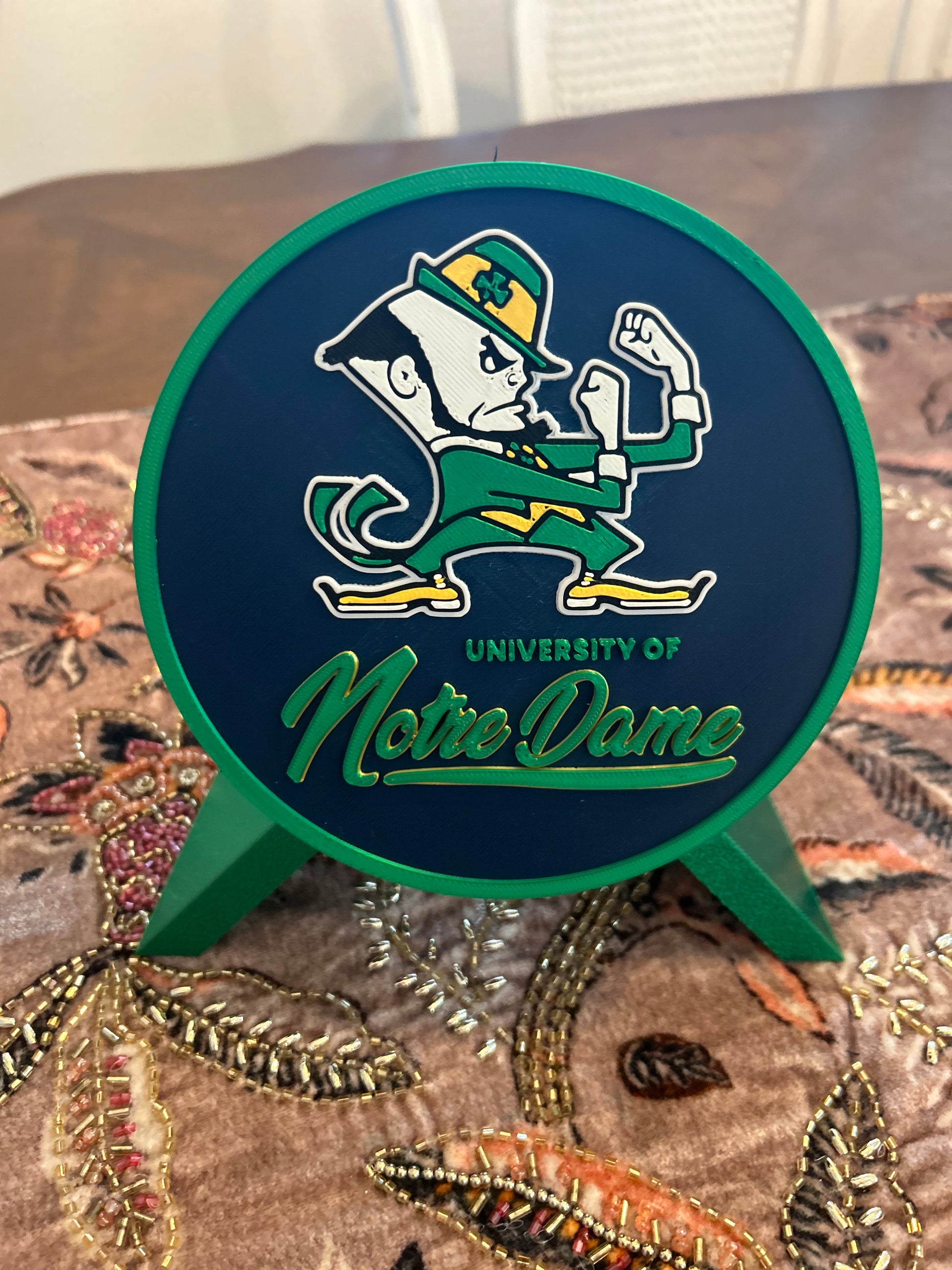 Notre Dame Fighting Irish leprechaun 3D printed round storage box with blue base and wedge display stand