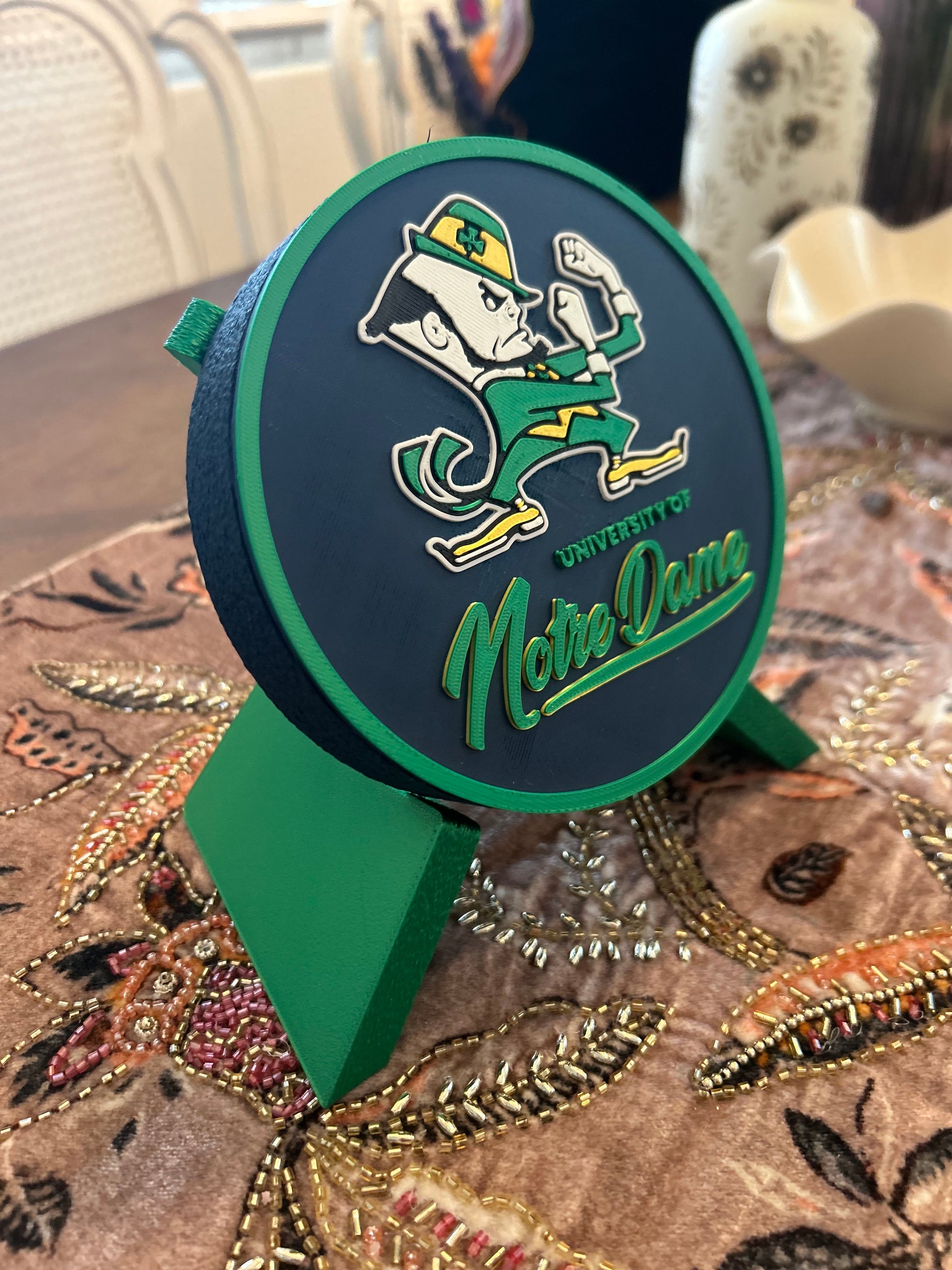 Notre Dame Fighting Irish leprechaun 3D printed round storage box with blue base and wedge display stand