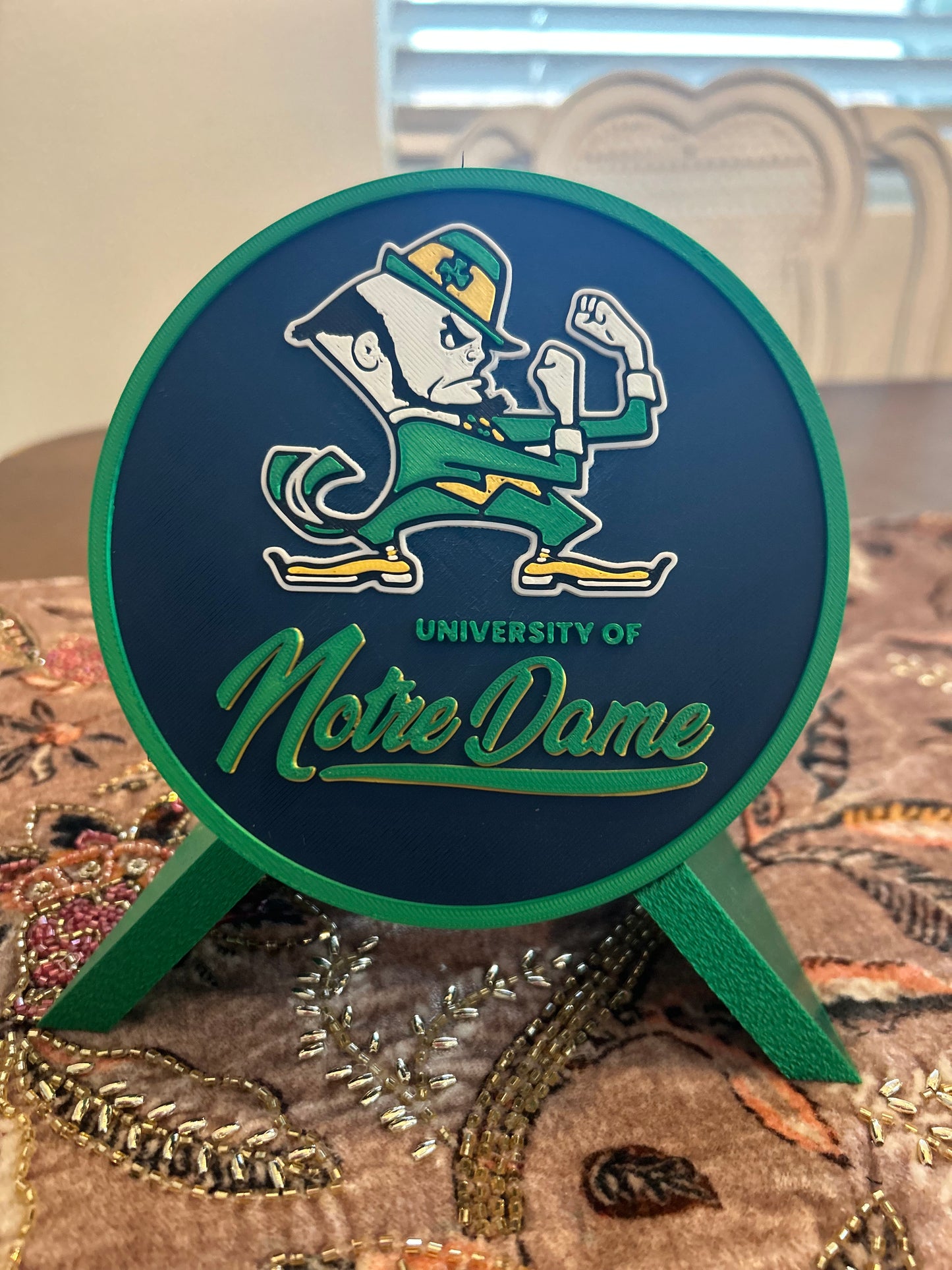 Notre Dame Fighting Irish leprechaun 3D printed round storage box with blue base and wedge display stand