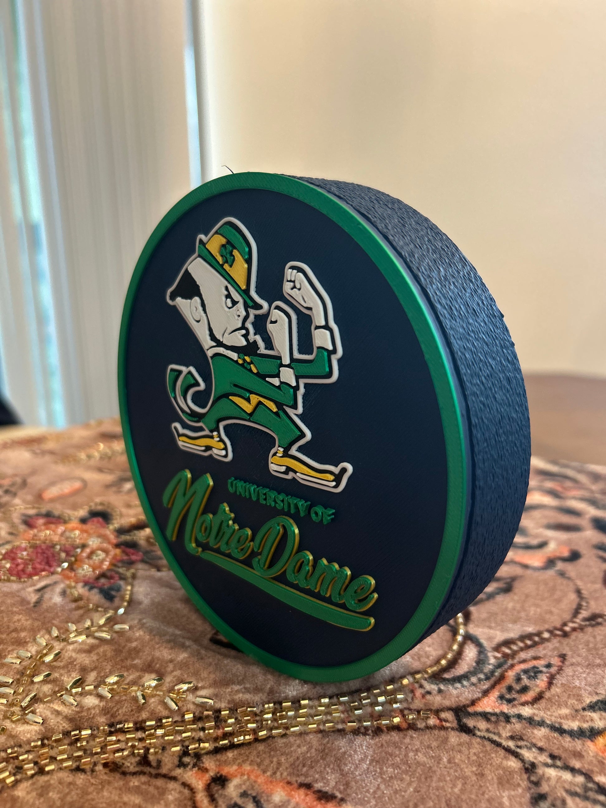 Notre Dame Fighting Irish leprechaun 3D printed round storage box with blue base and wedge display stand