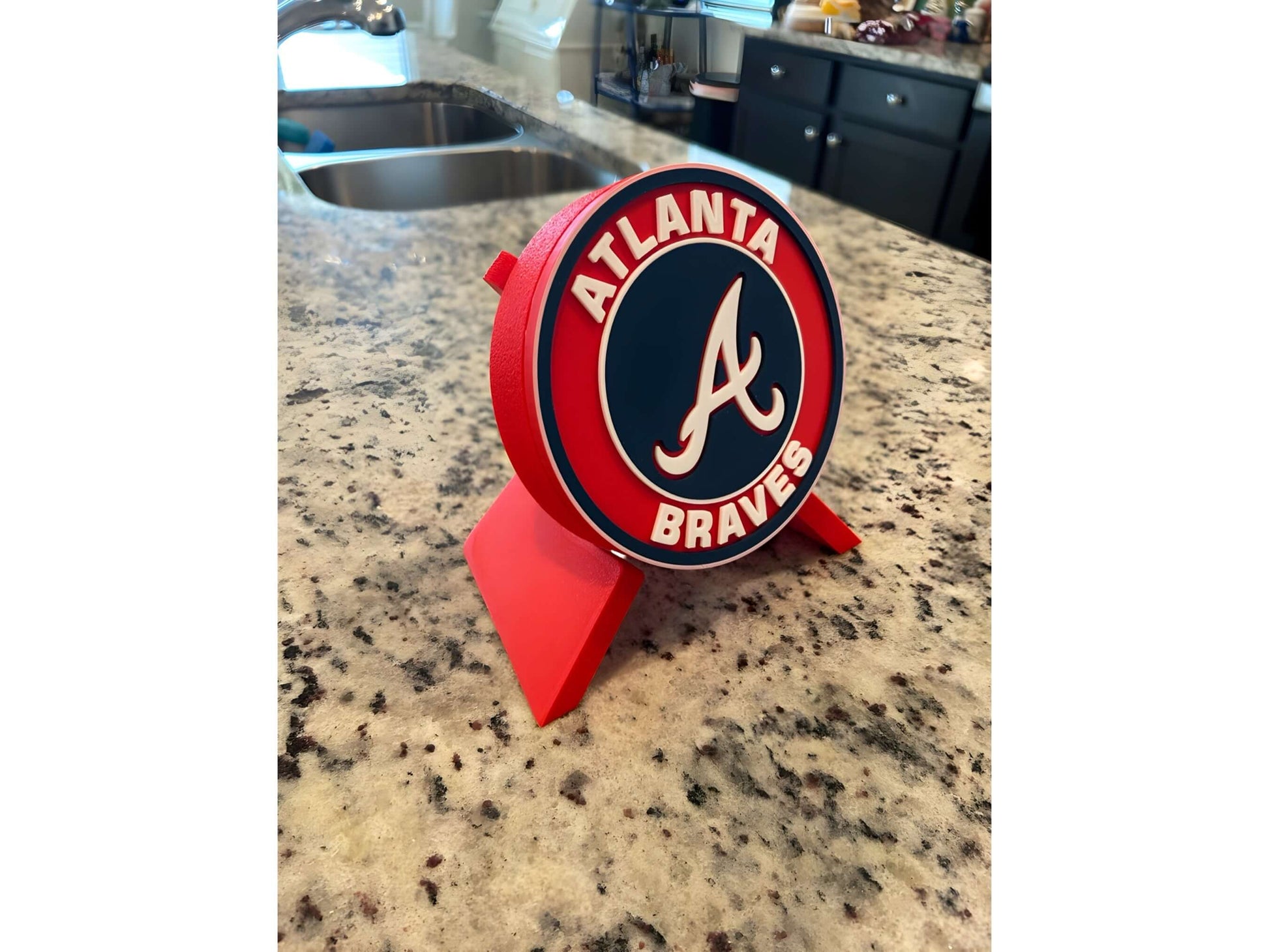 Atlanta Braves 3D printed plaque on kitchen counter, vibrant team colors, perfect decor for baseball fans.