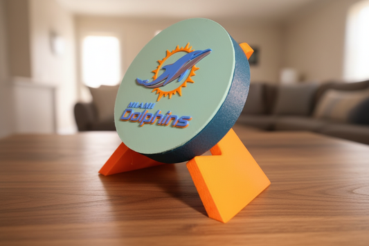 3D printed Miami Dolphins logo decorative display piece in aqua orange and navy colors on desk stand