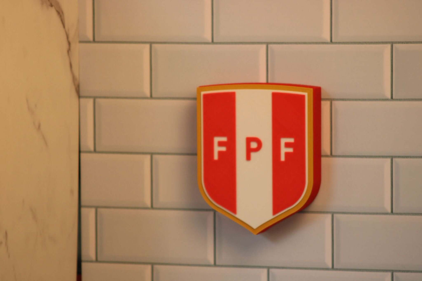 3D printed Peruvian Football Federation plaque, vibrant colors, unique piece for soccer fans, no assembly required.