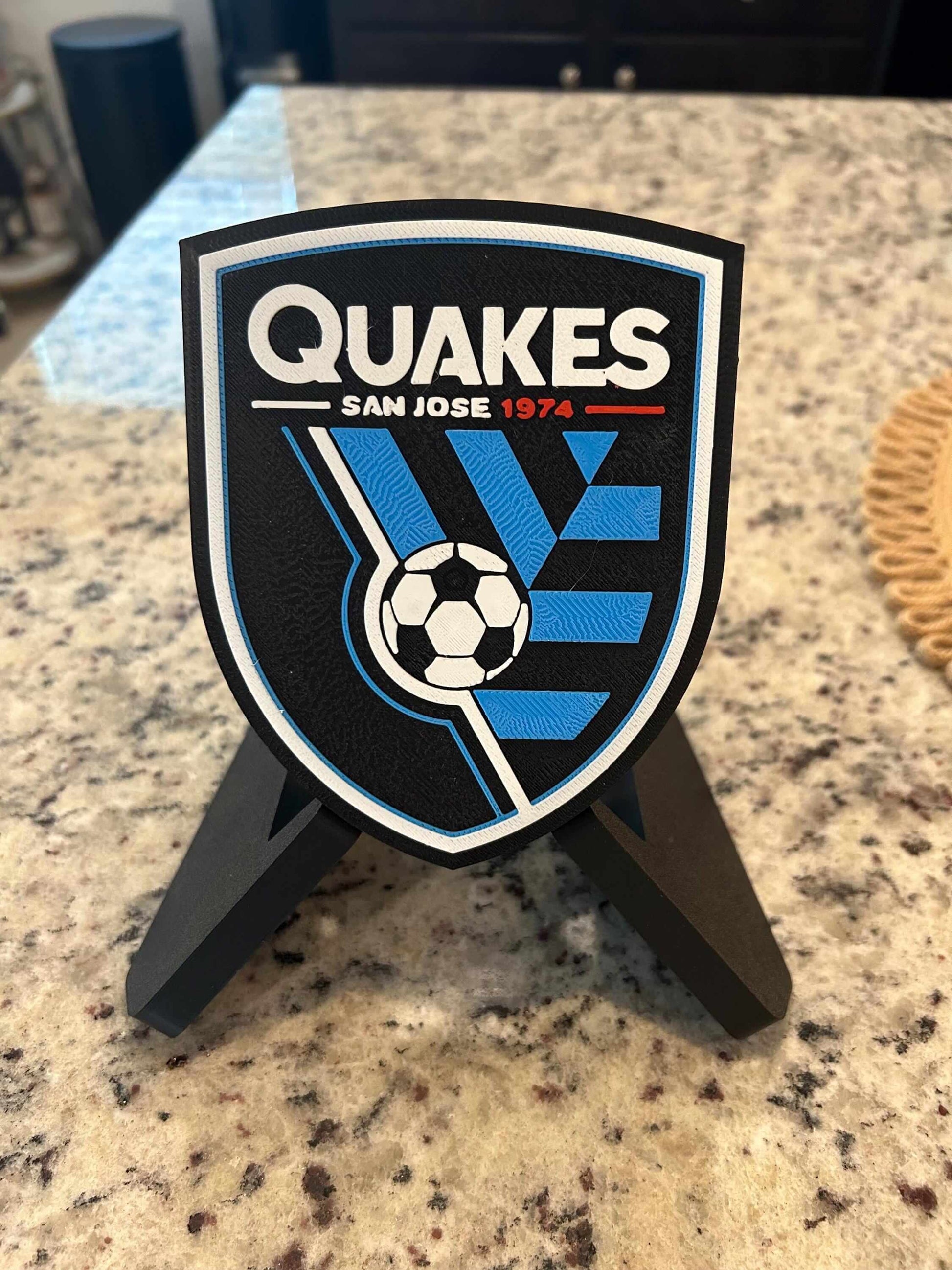 San Jose Earthquakes 3D printed plaque displayed on stand, showcasing vibrant colors and unique design for soccer fans.