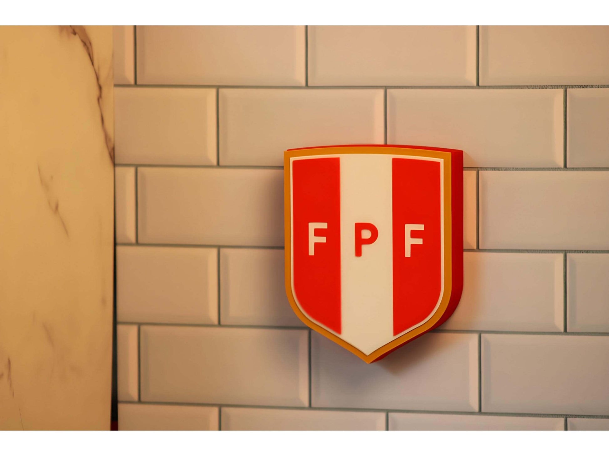 3D printed Peruvian Football Federation crest plaque on a wall, showcasing vibrant colors and high-quality materials.