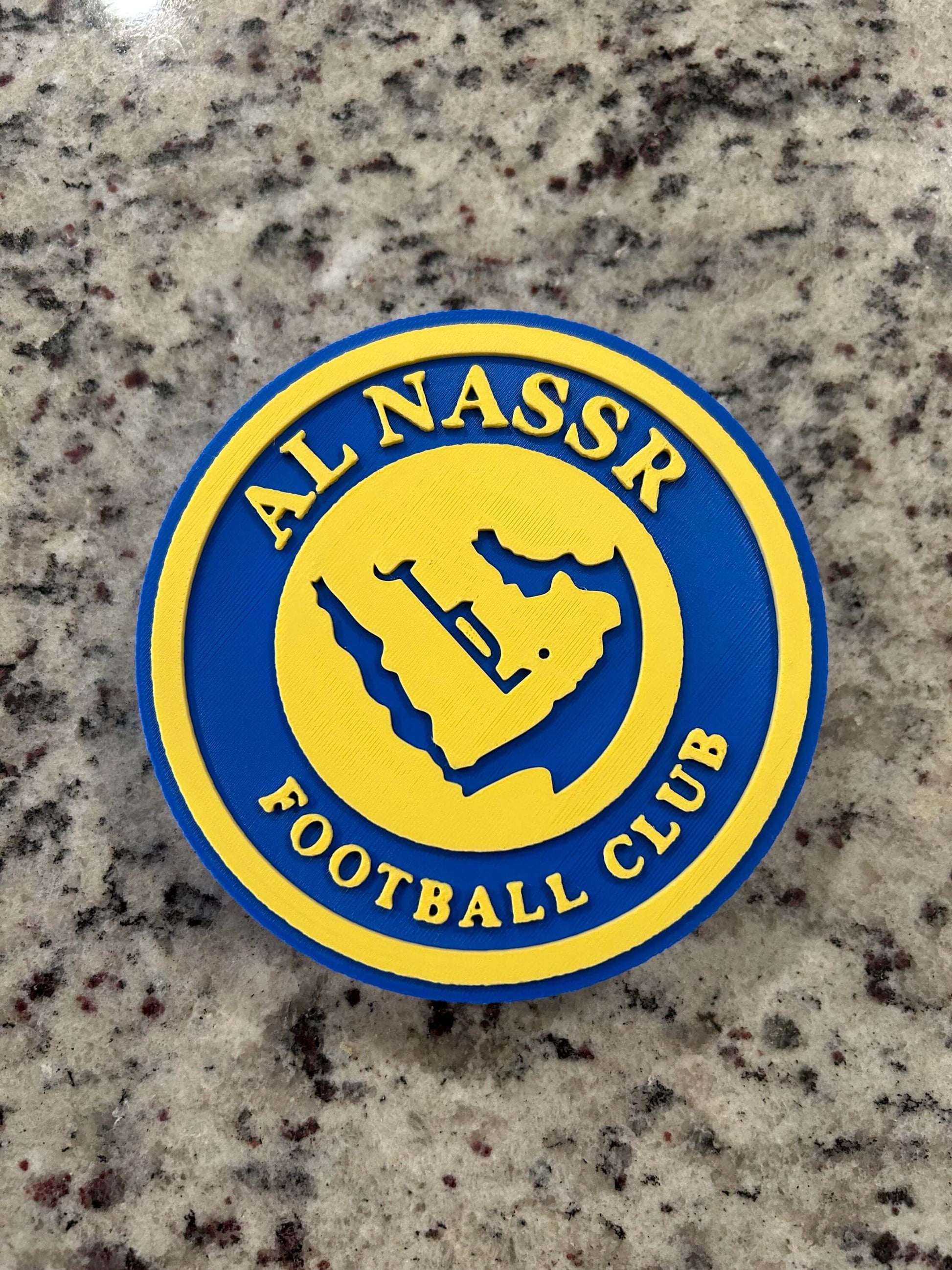 Al Nassr FC logo in vibrant blue and yellow colors, representing the Saudi football club's proud identity.