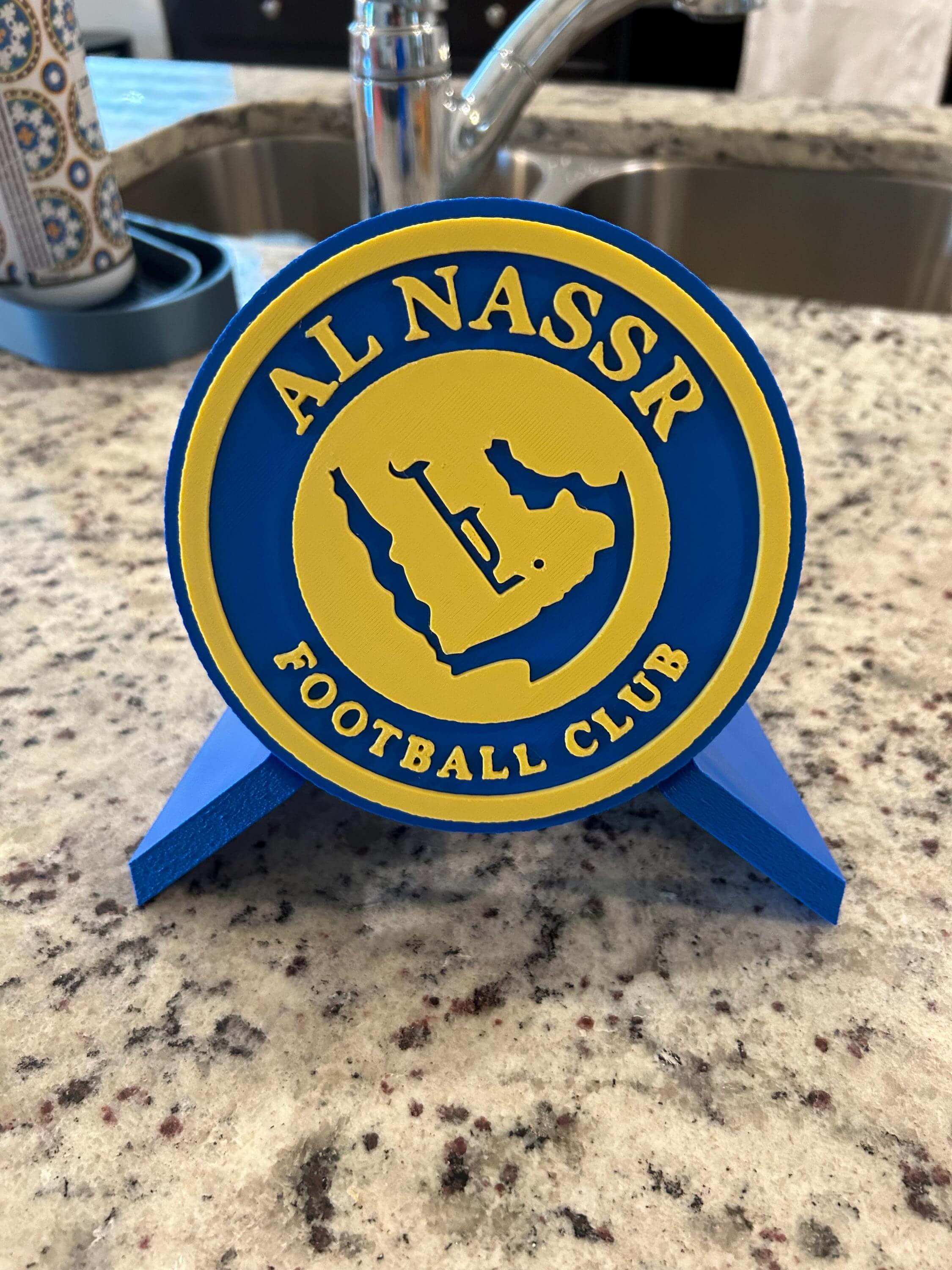 Al Nassr FC 3D printed plaque in blue and yellow, showcasing the team's logo, perfect for passionate soccer fans.