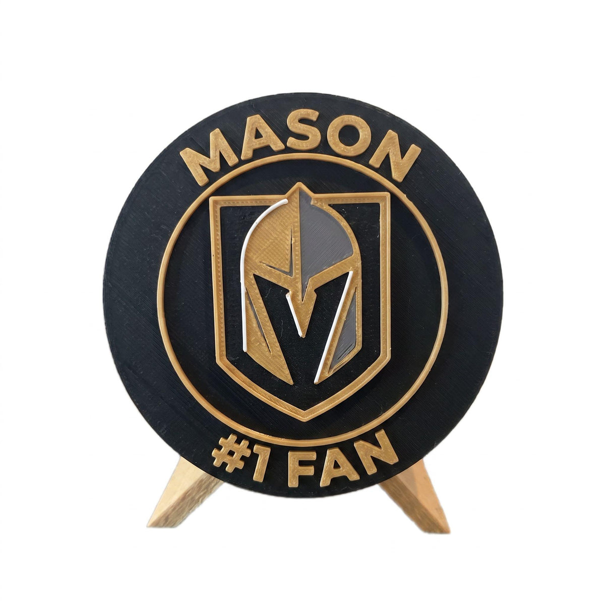 Personalized Vegas Golden Knights medallion example with the name MASON on top and #1 FAN on the bottom, 3D printed to order