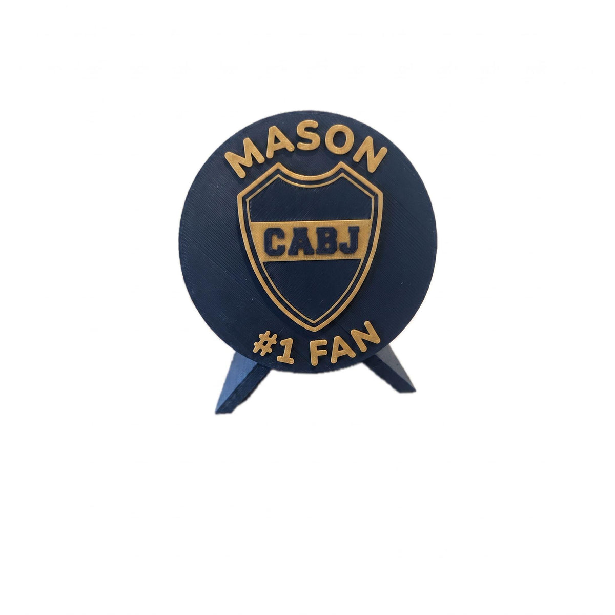 Personalized Boca Juniors medallion example with the name MASON on top and #1 FAN on the bottom, 3D printed to order