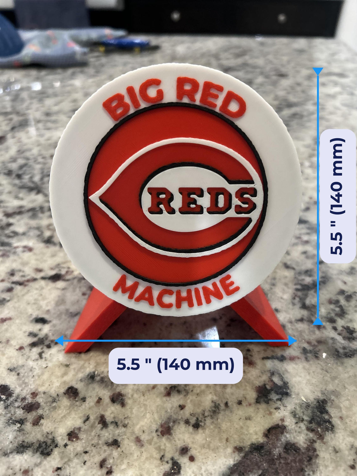 Size guide: Cincinnati Reds round medallion 5.5 inches (140 mm) across and about 1 inch deep on the stand
