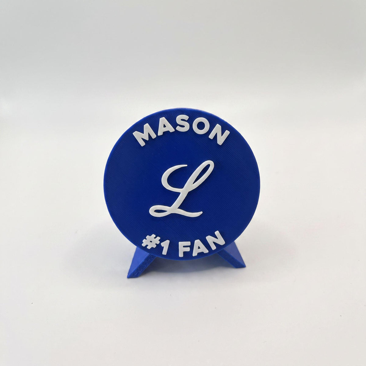 Personalized Tigres del Licey medallion example with the name MASON on top and #1 FAN on the bottom, 3D printed to order