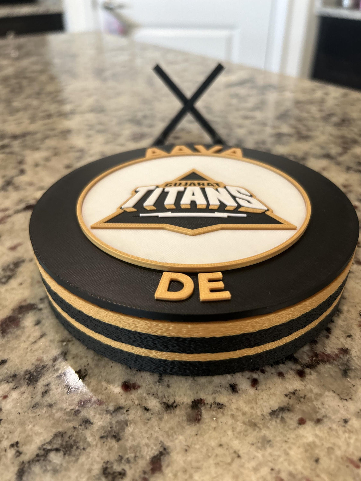Gujarat Titans GT 3D printed black and gold roundel display with leg stand and hidden stash box, personalized IPL cricket fan gift, made in USA