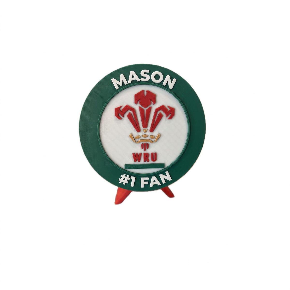 Personalized rugby roundel example with the name MASON on top and #1 FAN on the bottom, 3D printed to order