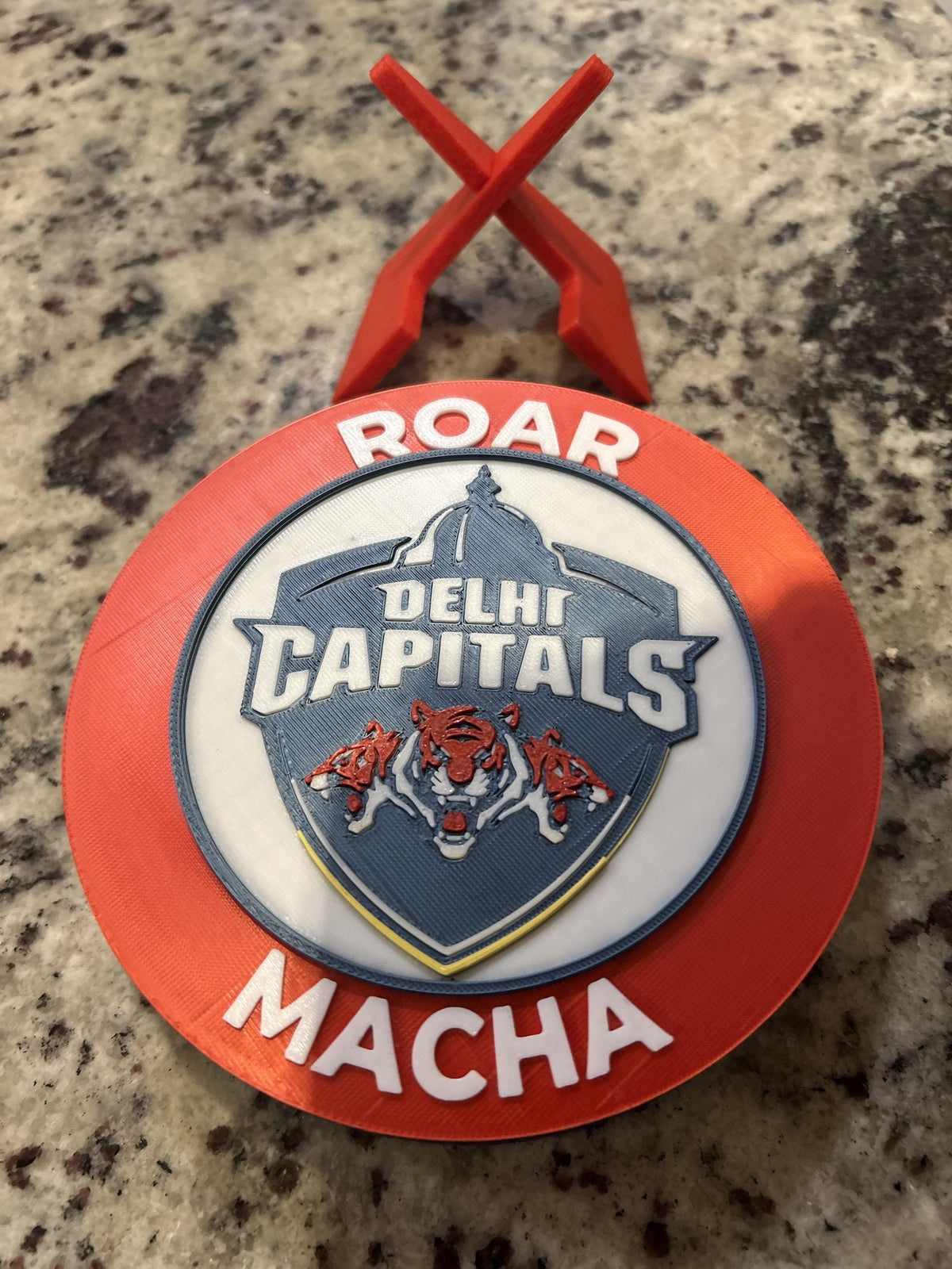 Delhi Capitals 3D printed red roundel display with stand and hidden stash box, personalized Roar Macha IPL cricket fan gift, made in USA