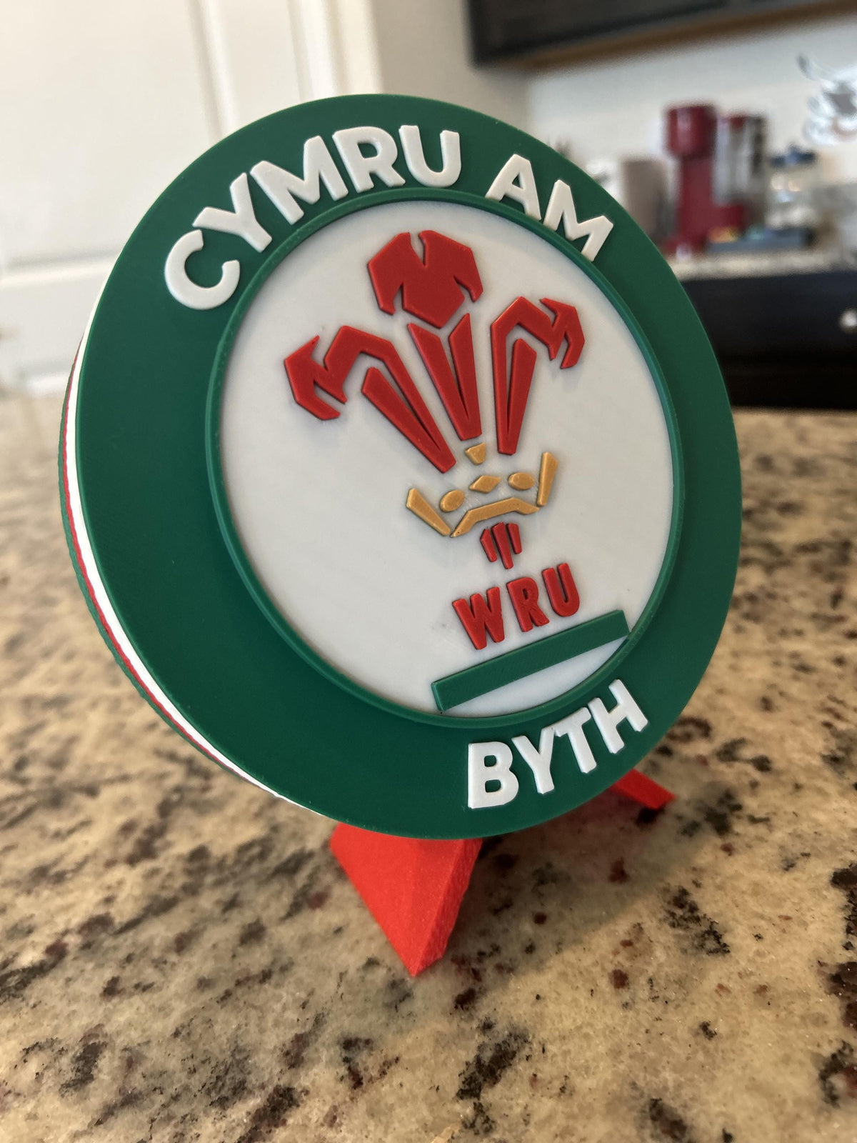 Wales rugby WRU 3D printed feathers crest roundel with Welsh tricolor base and green stand and hidden stash box, personalized Cymru am Byth rugby fan gift, made in USA